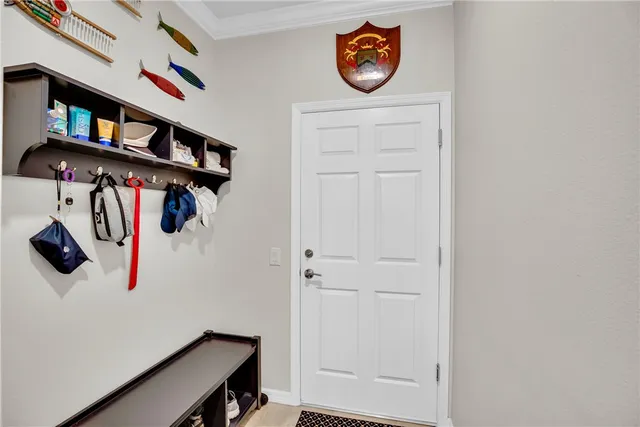 a living room with furniture a flat screen tv and a large window