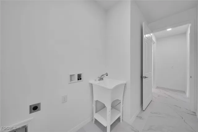 a view of an empty room with windows and storage