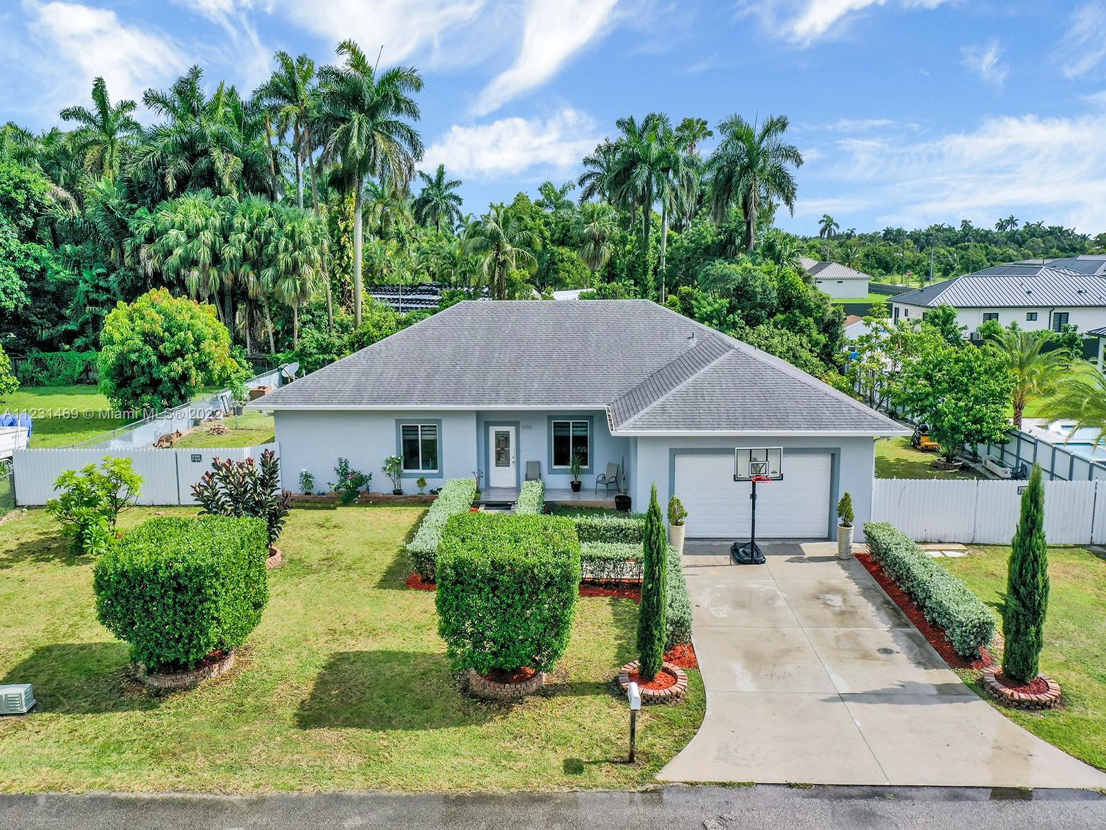 front view of a house with a yard
