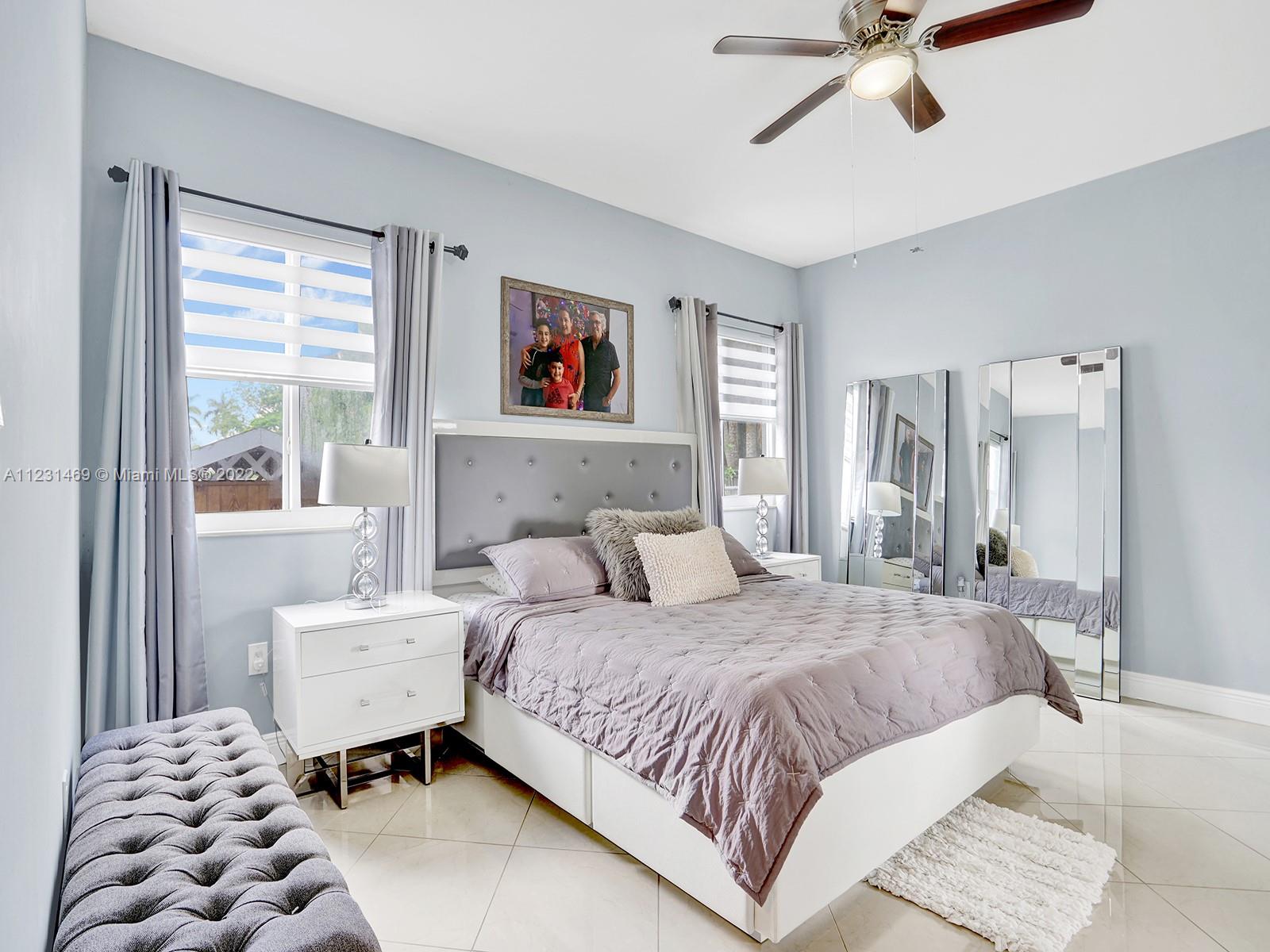 17335 Southwest 298th Street Homestead, FL 33030 - Photo 18 of 32 a bedroom with a bed and a window