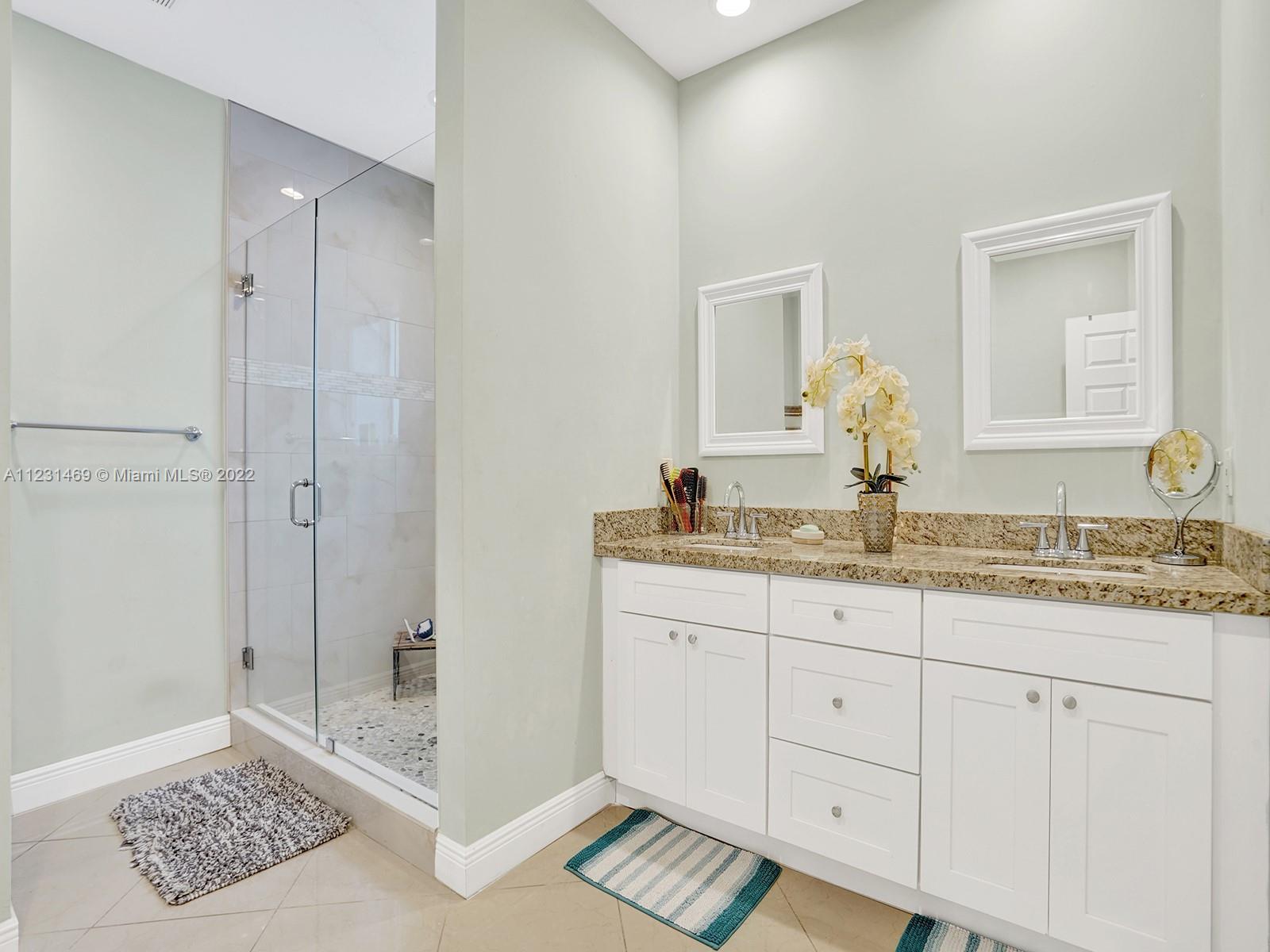 17335 Southwest 298th Street Homestead, FL 33030 - Photo 23 of 32 a bathroom with a sink and a mirror