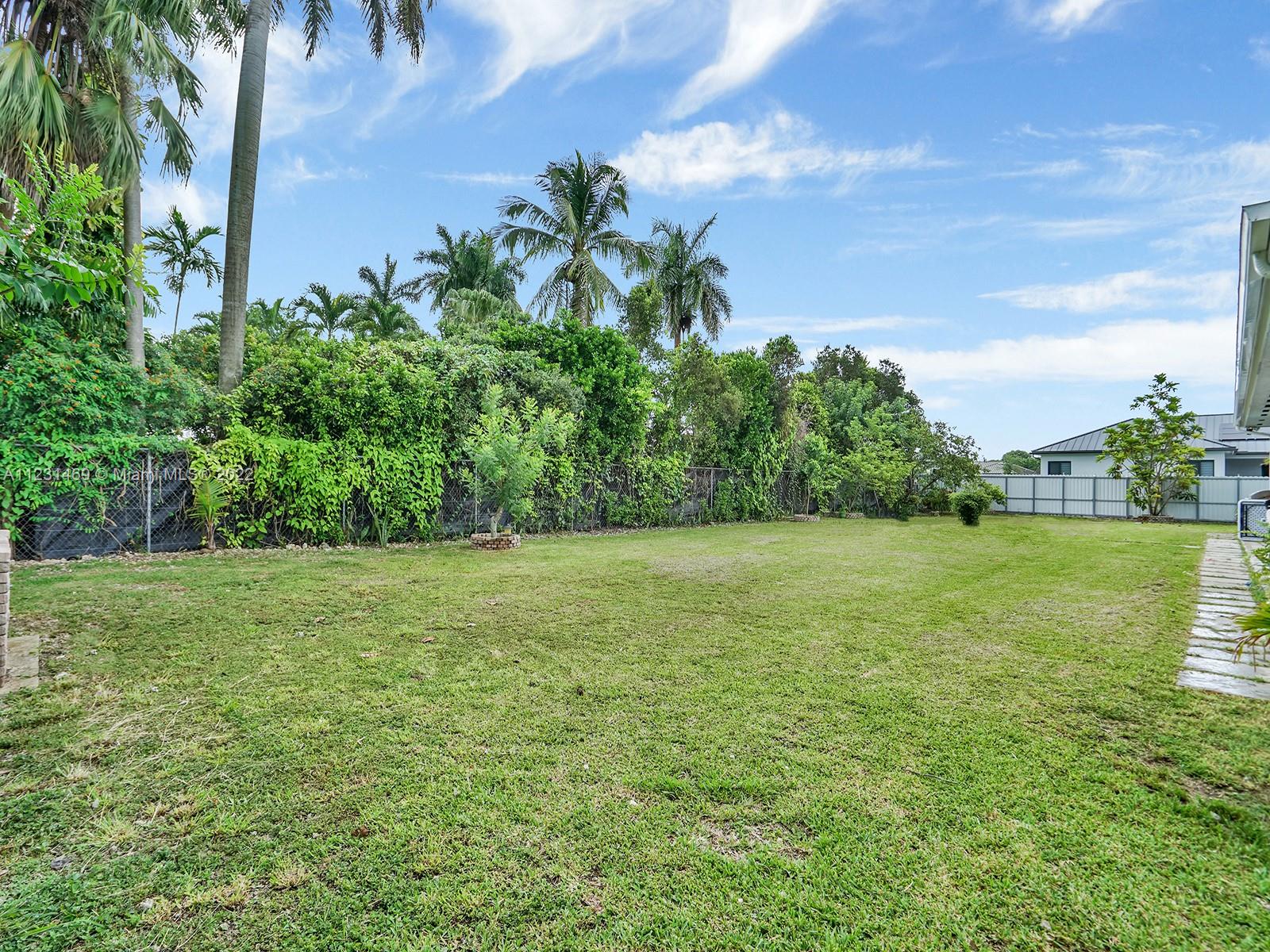 17335 Southwest 298th Street Homestead, FL 33030 - Photo 28 of 32 a view of a yard with a house