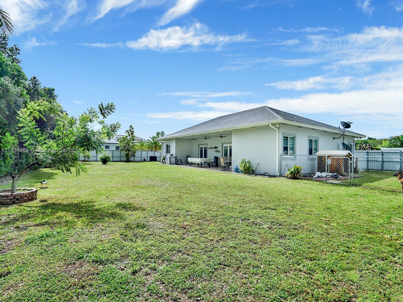 17335 Southwest 298th Street Homestead, FL 33030 - Photo 29 of 32 a view of a house with backyard and garden