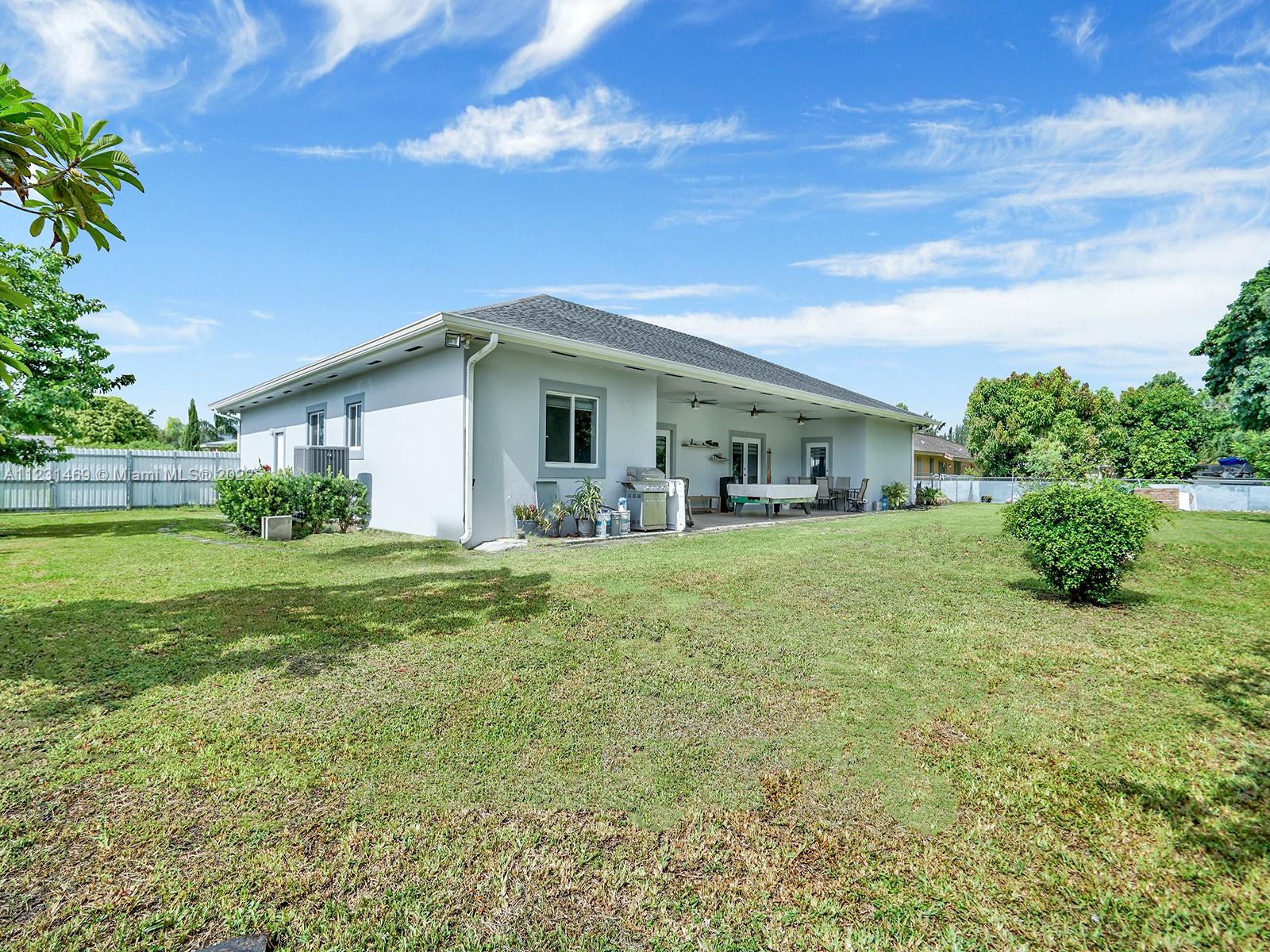 17335 Southwest 298th Street Homestead, FL 33030 - Photo 30 of 32 a front view of house with yard