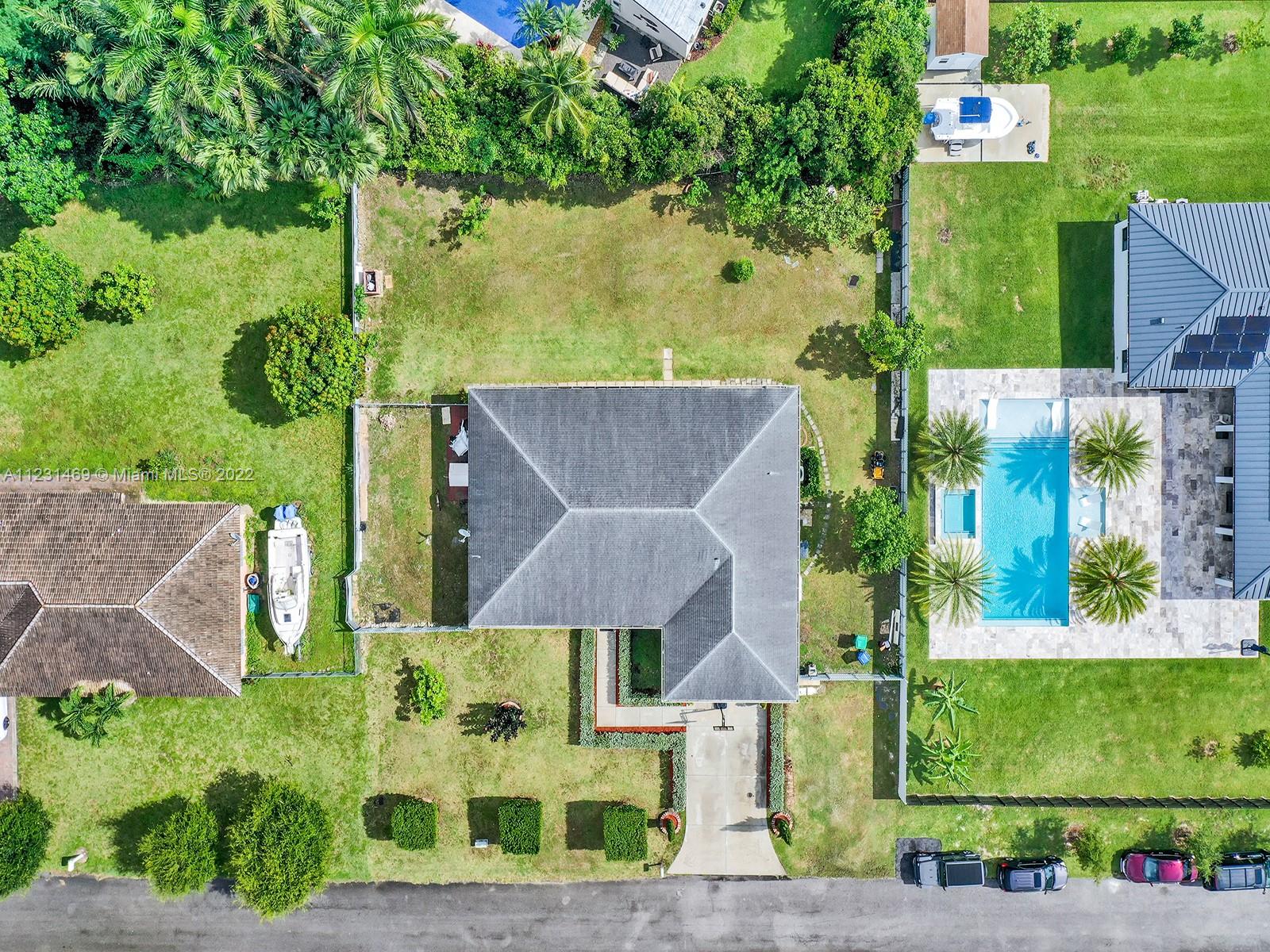 17335 Southwest 298th Street Homestead, FL 33030 - Photo 3 of 32 an aerial view of a house with a garden