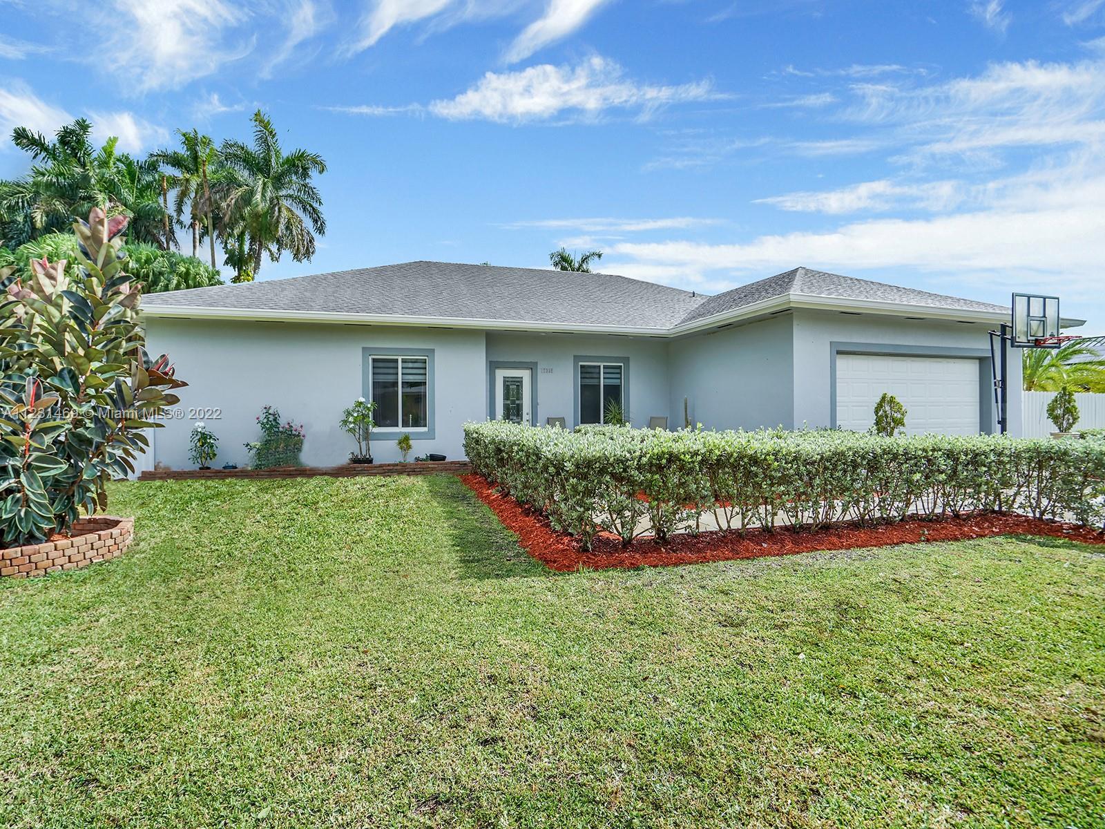 17335 Southwest 298th Street Homestead, FL 33030 - Photo 32 of 32 a view of an house with backyard space and garden