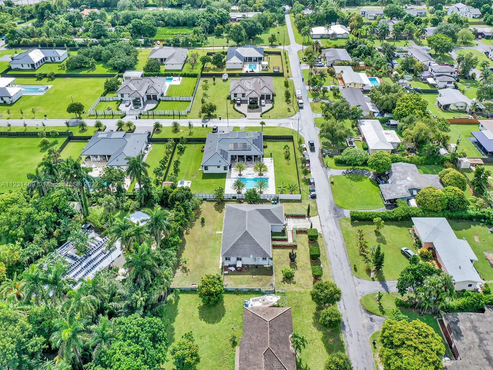 17335 Southwest 298th Street Homestead, FL 33030 - Photo 4 of 32 an aerial view of multiple house