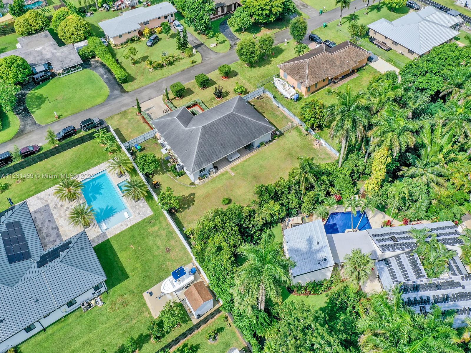 17335 Southwest 298th Street Homestead, FL 33030 - Photo 5 of 32 an aerial view of a house a yard and outdoor seating