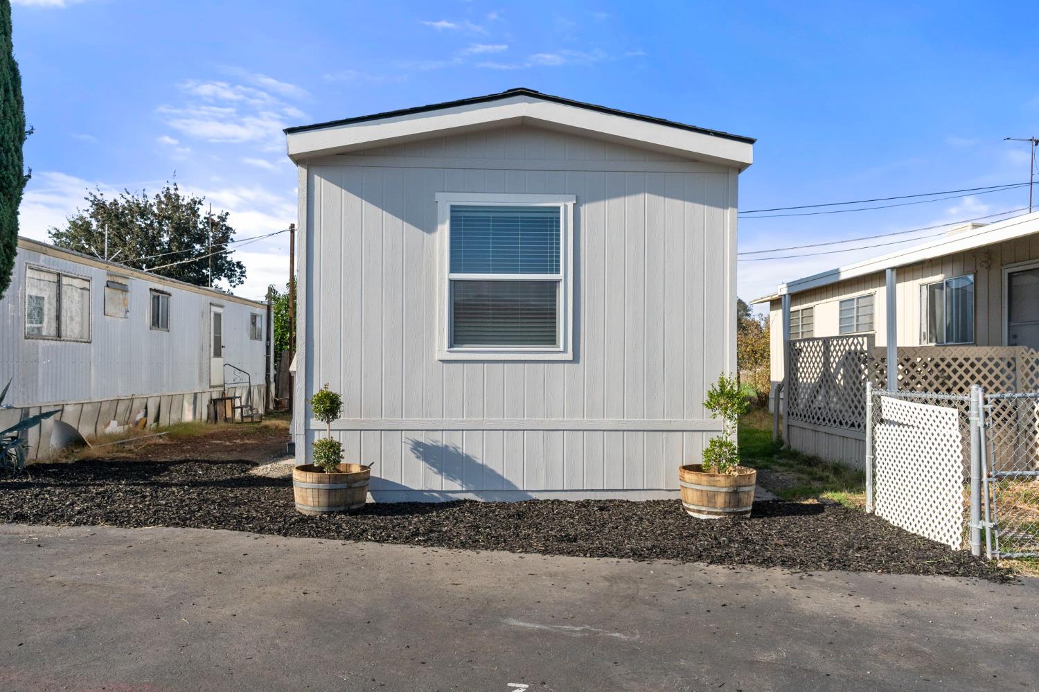 3707 Farmington Road, Unit 7 Stockton, CA 95215 - Photo 2 of 20 a front view of a house with a yard