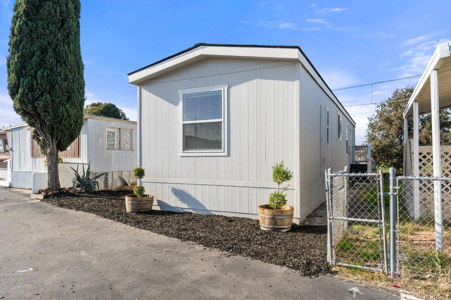 3707 Farmington Road, Unit 7 Stockton, CA 95215 - Photo 3 of 20 a front view of a house with garden