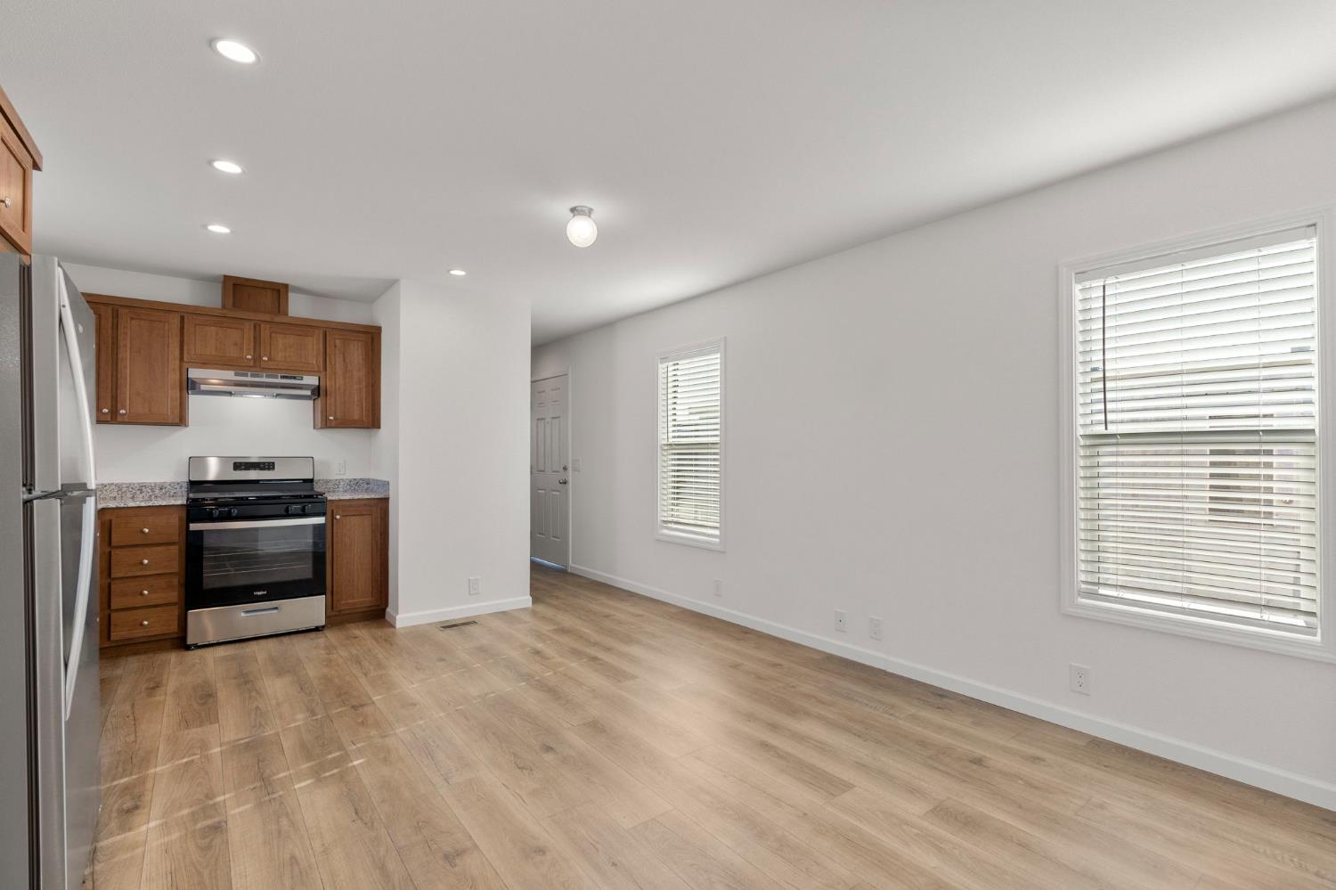 3707 Farmington Road, Unit 7 Stockton, CA 95215 - Photo 5 of 20 a kitchen with stainless steel appliances a refrigerator and a stove top oven