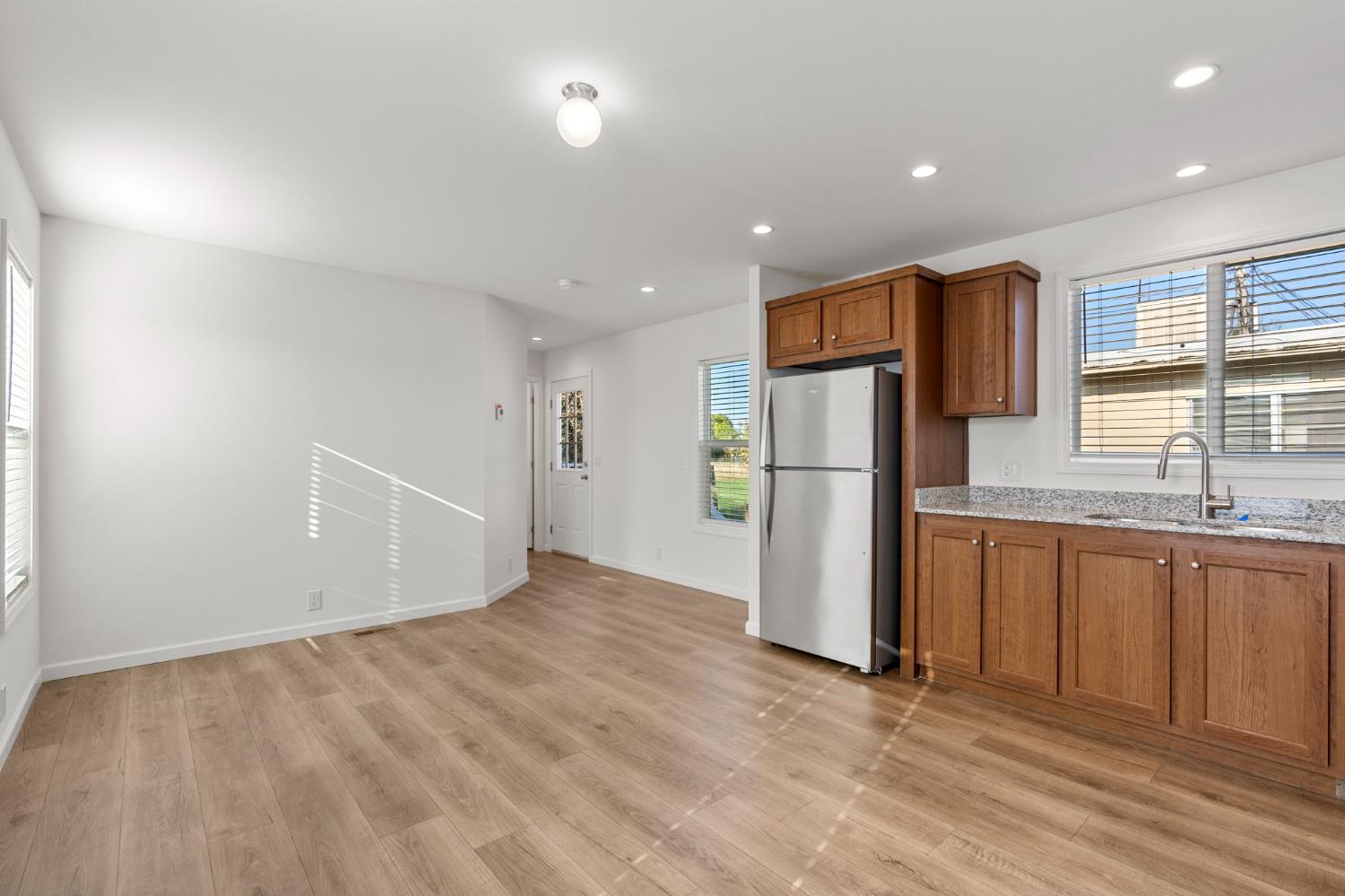 3707 Farmington Road, Unit 7 Stockton, CA 95215 - Photo 8 of 20 a view of a kitchen with a sink and a refrigerator