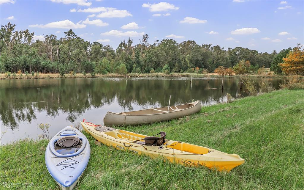 400 Crouch Road Benton, LA 71006 - Photo 5 of 40 a view of a lake with houses in the back