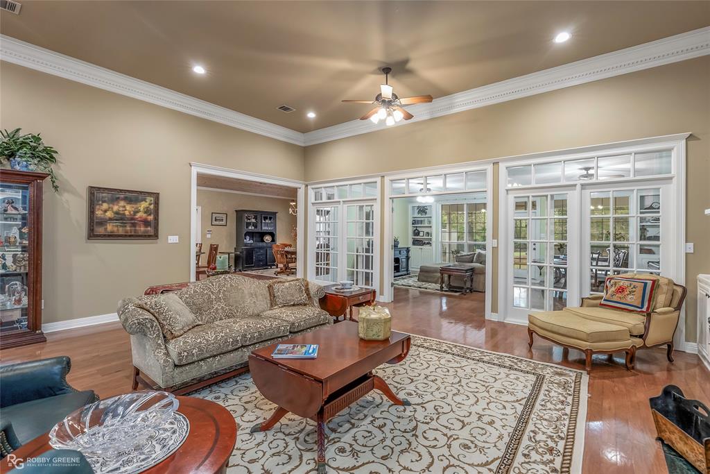400 Crouch Road Benton, LA 71006 - Photo 8 of 40 a living room with furniture and a chandelier