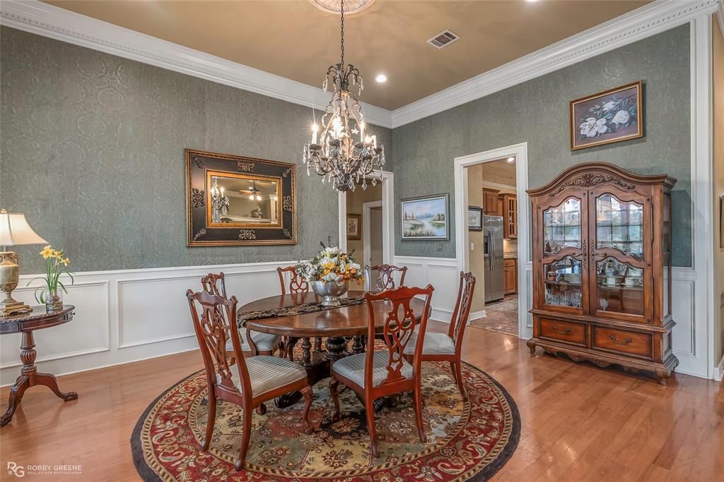 400 Crouch Road Benton, LA 71006 - Photo 10 of 40 a view of a dining room with furniture window and wooden floor