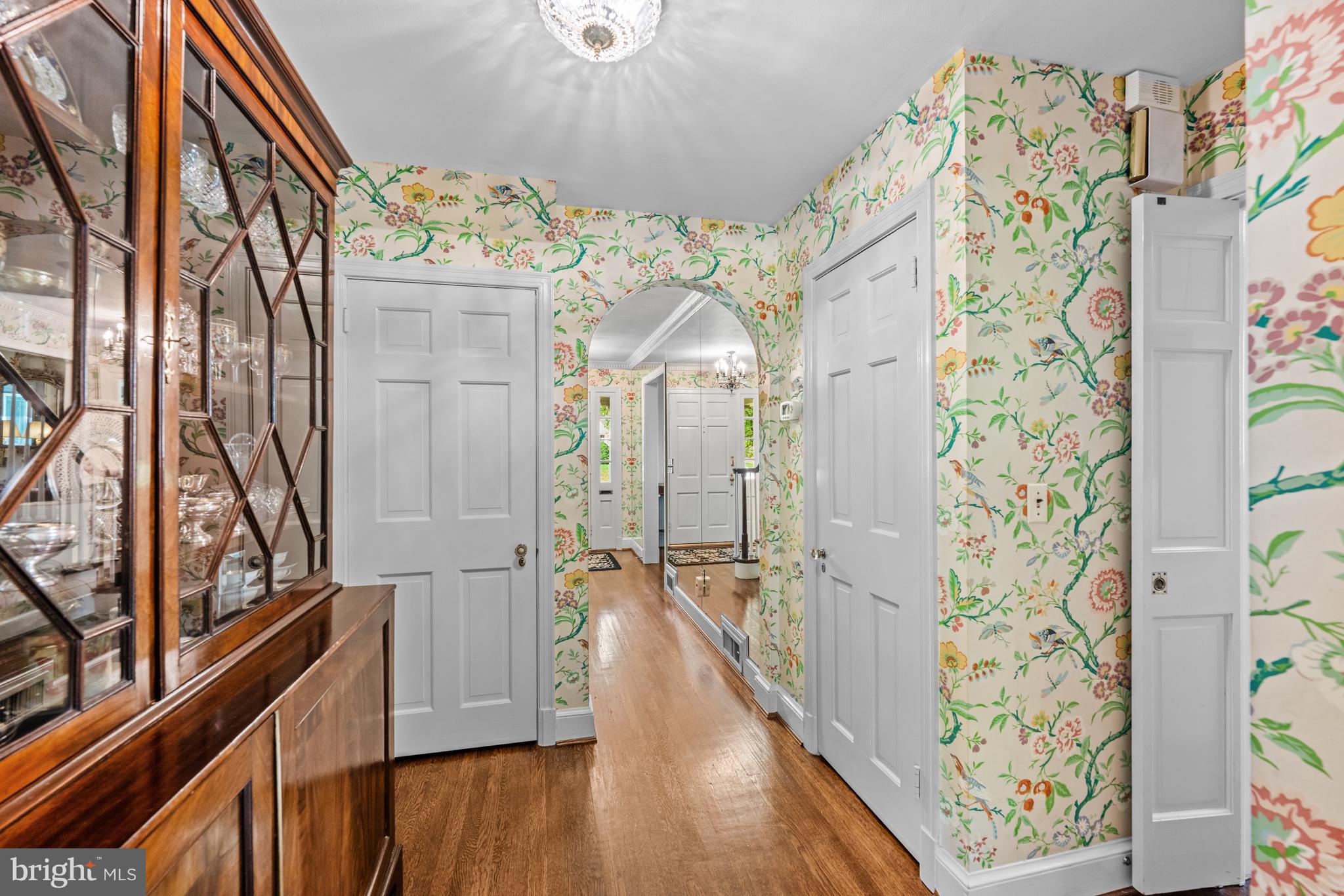5511 Grove Street Chevy Chase, MD 20815 - Photo 17 of 33 a view of a hallway with wooden floor and staircase