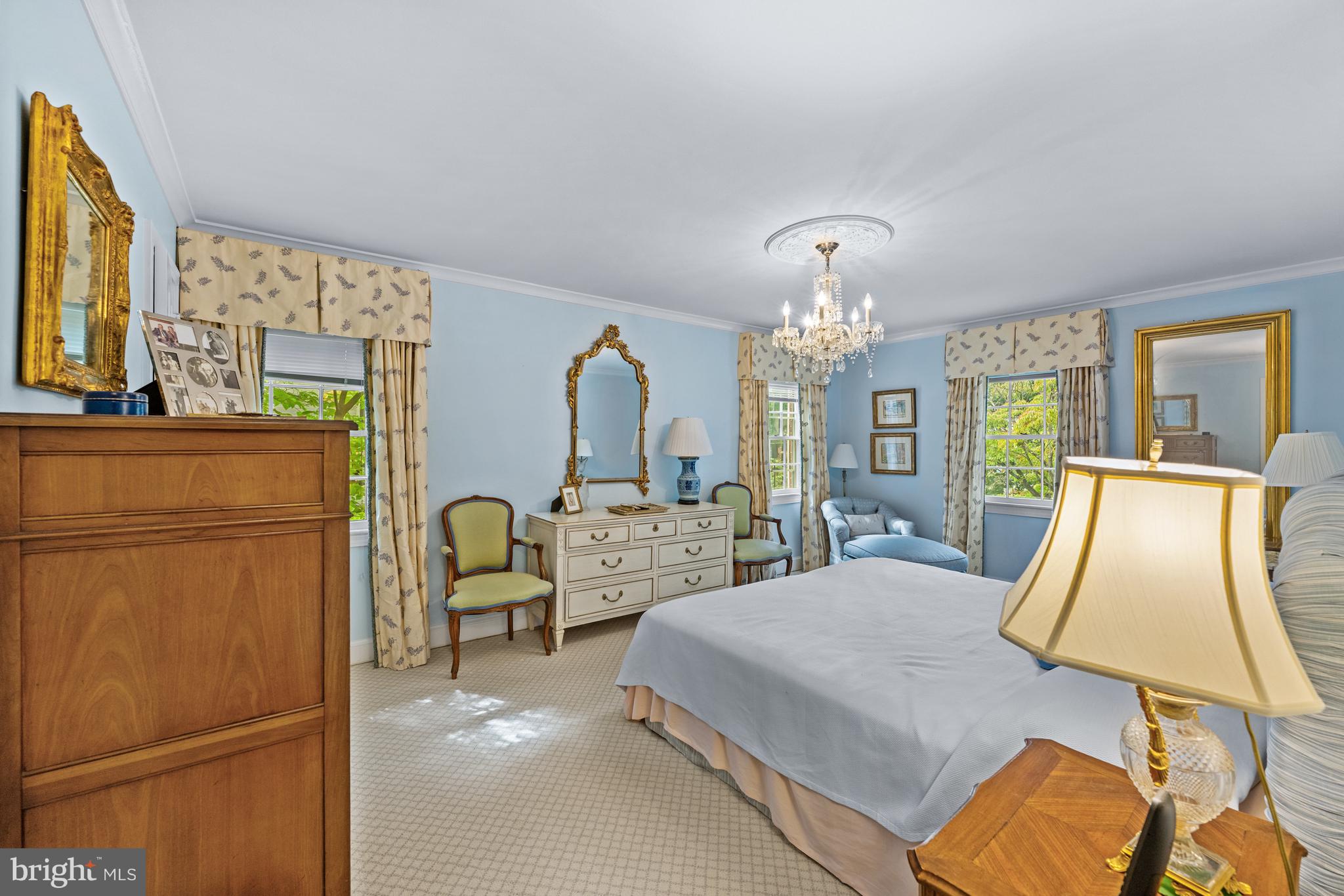 5511 Grove Street Chevy Chase, MD 20815 - Photo 19 of 33 a bedroom with a bed flat screen tv and window