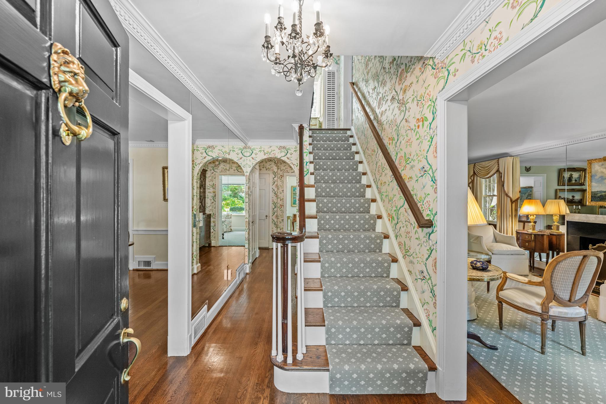 5511 Grove Street Chevy Chase, MD 20815 - Photo 3 of 33 a view of an entryway with wooden floor and staircase