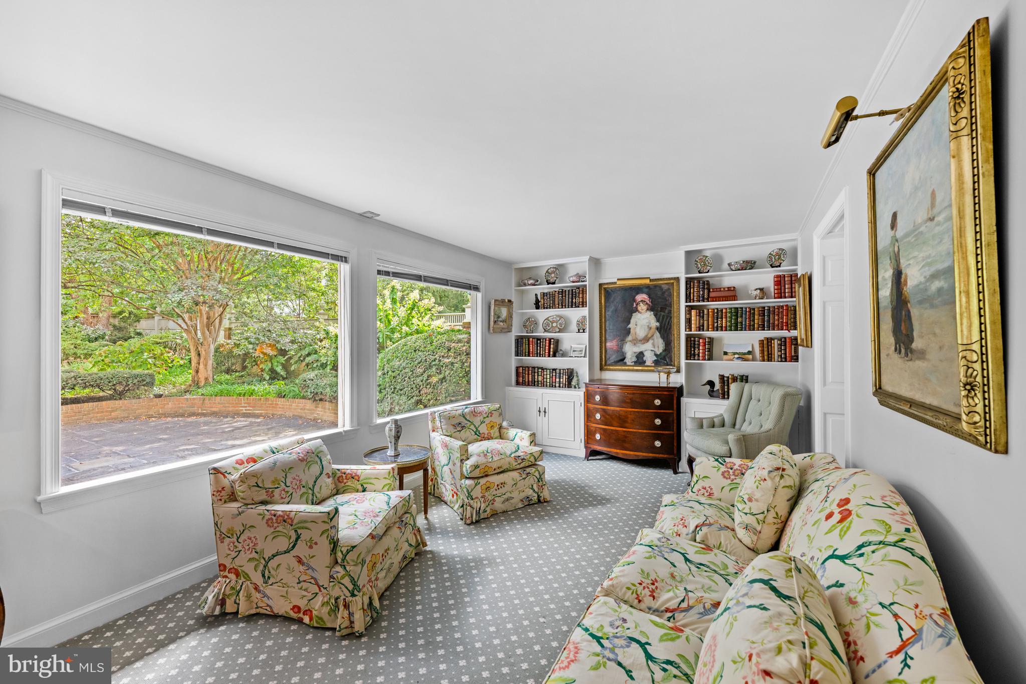 5511 Grove Street Chevy Chase, MD 20815 - Photo 9 of 33 a living room with furniture and a fireplace
