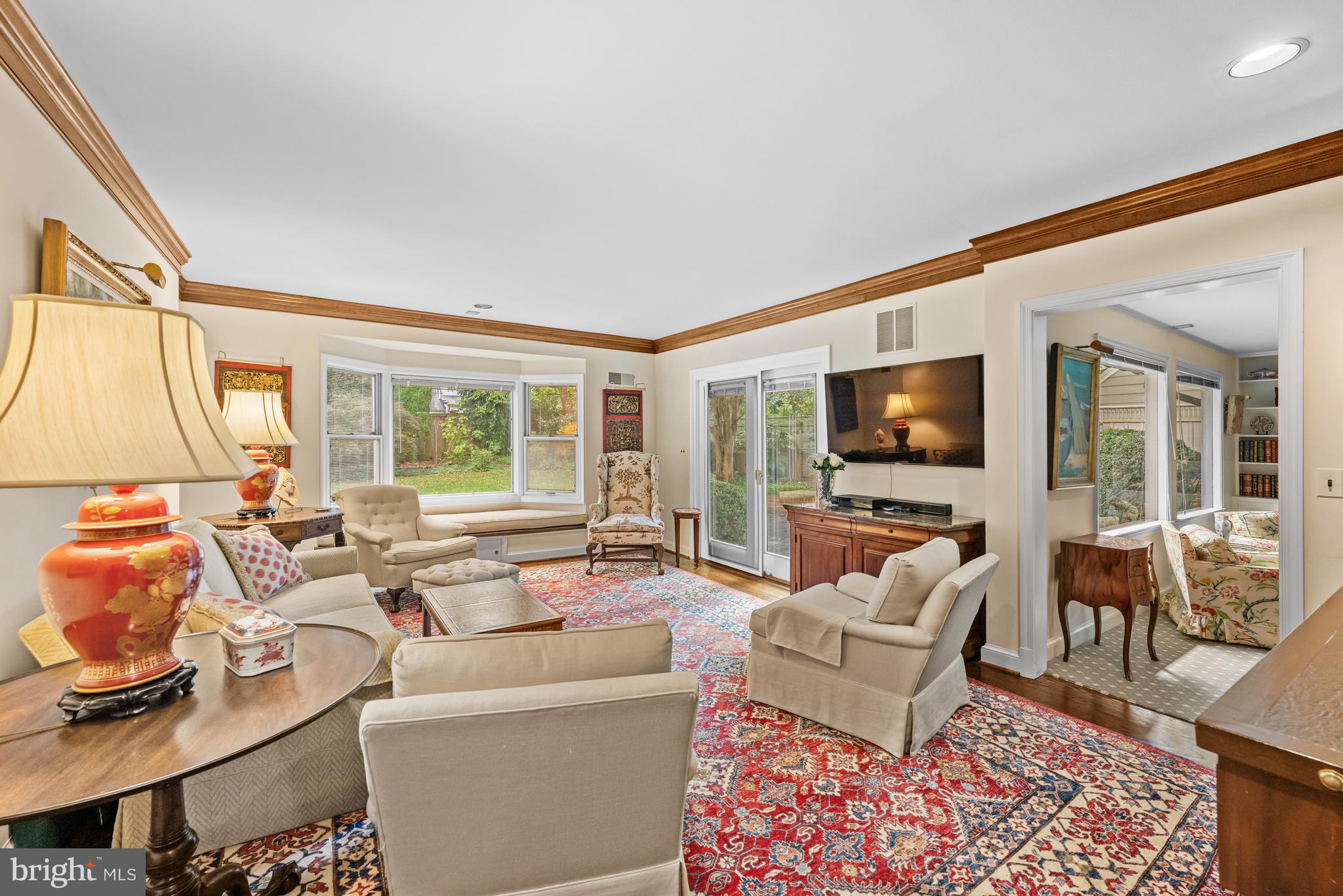 5511 Grove Street Chevy Chase, MD 20815 - Photo 10 of 33 a living room with furniture and a flat screen tv