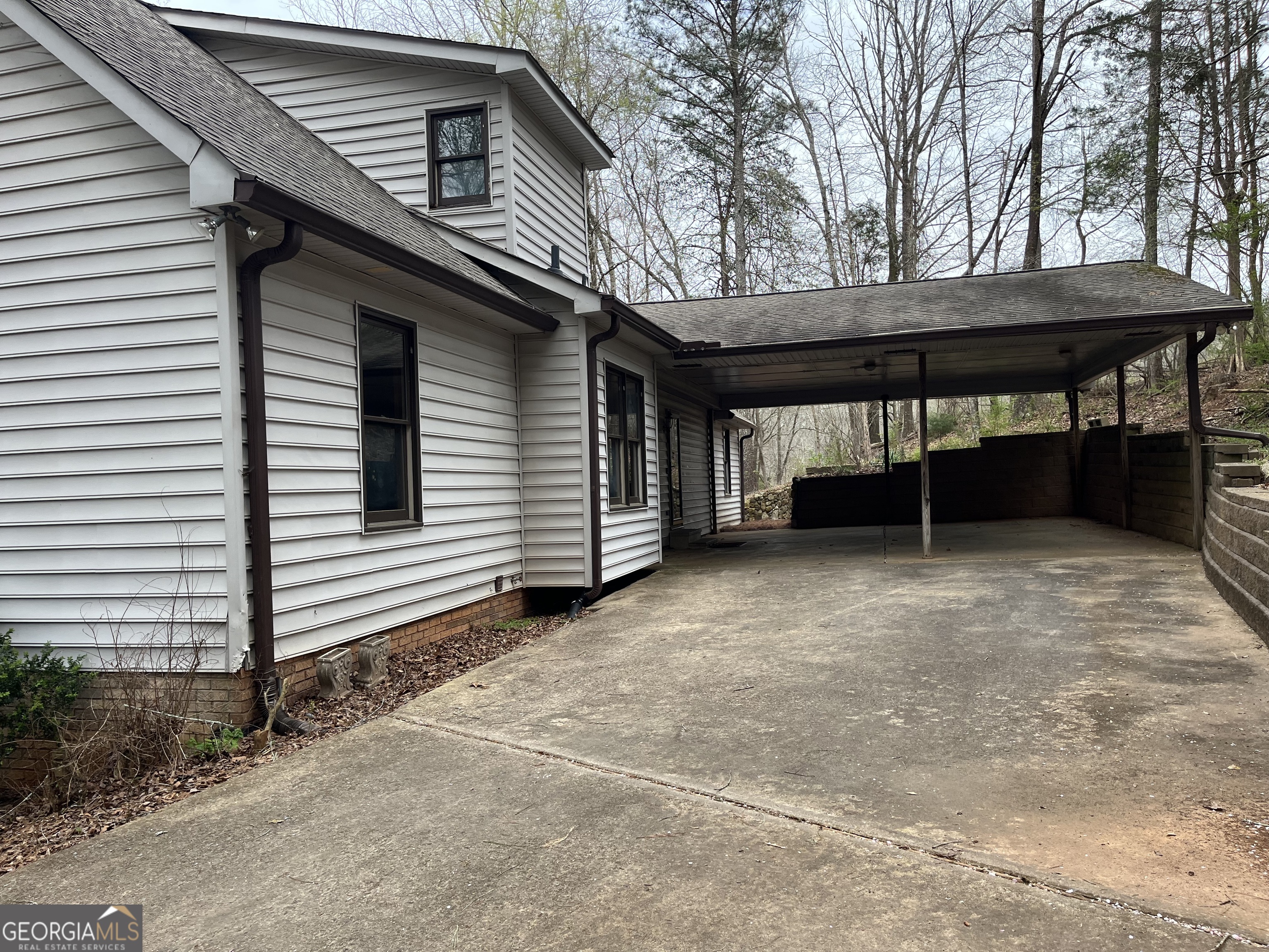 475 Davis Road Southwest Cave Spring, GA 30124 - Photo 2 of 27 a view of house with backyard and trees