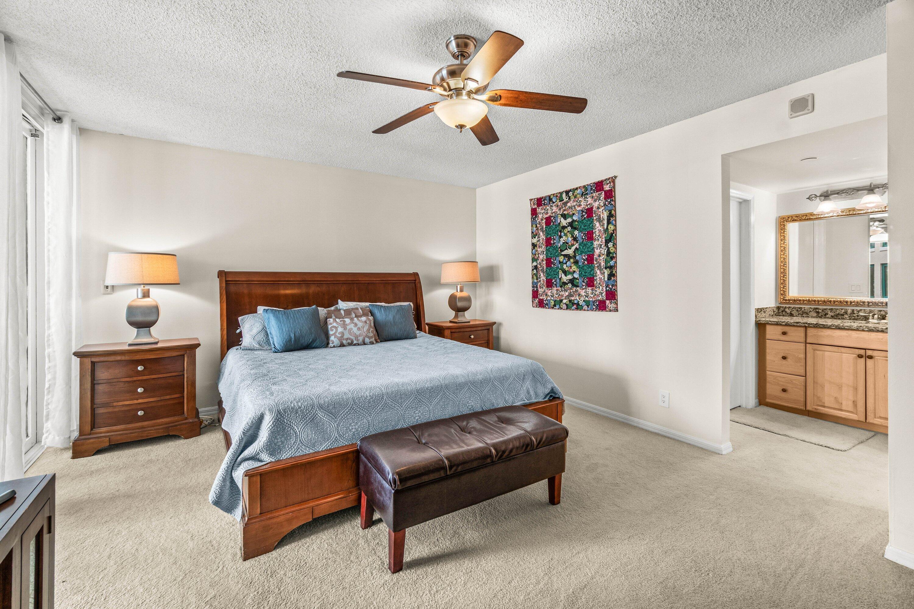 100 Southeast 5th Avenue, Unit 311 Boca Raton, FL 33432 - Photo 13 of 57 a bedroom with a bed and a cabinets