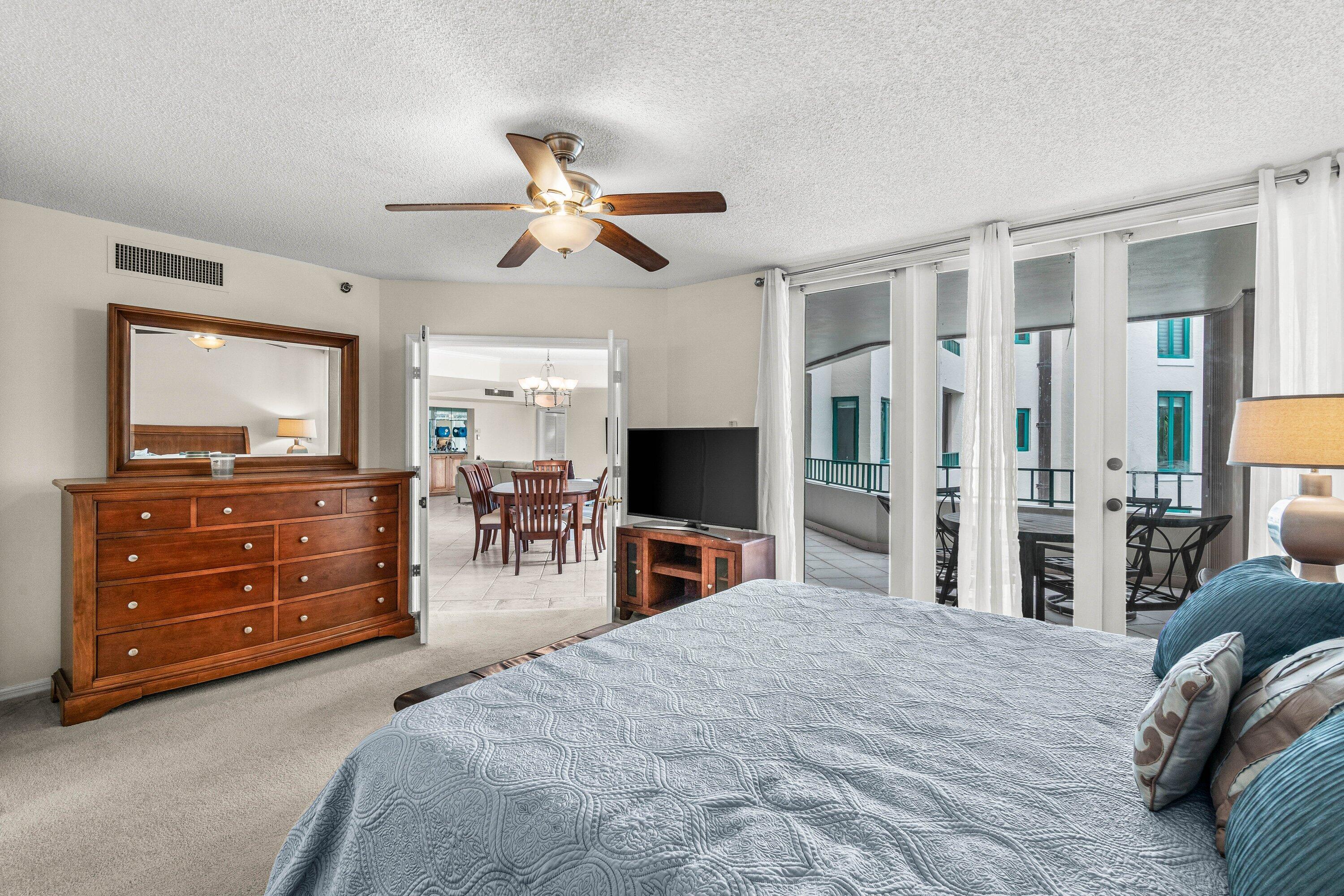 100 Southeast 5th Avenue, Unit 311 Boca Raton, FL 33432 - Photo 14 of 57 a bedroom with a bed and a flat screen tv