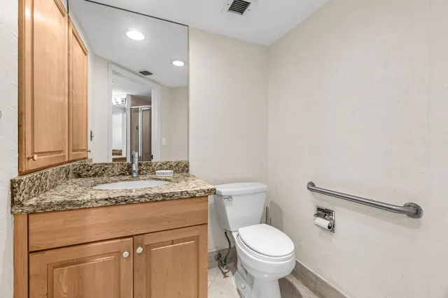 a bathroom with a shower and a sink