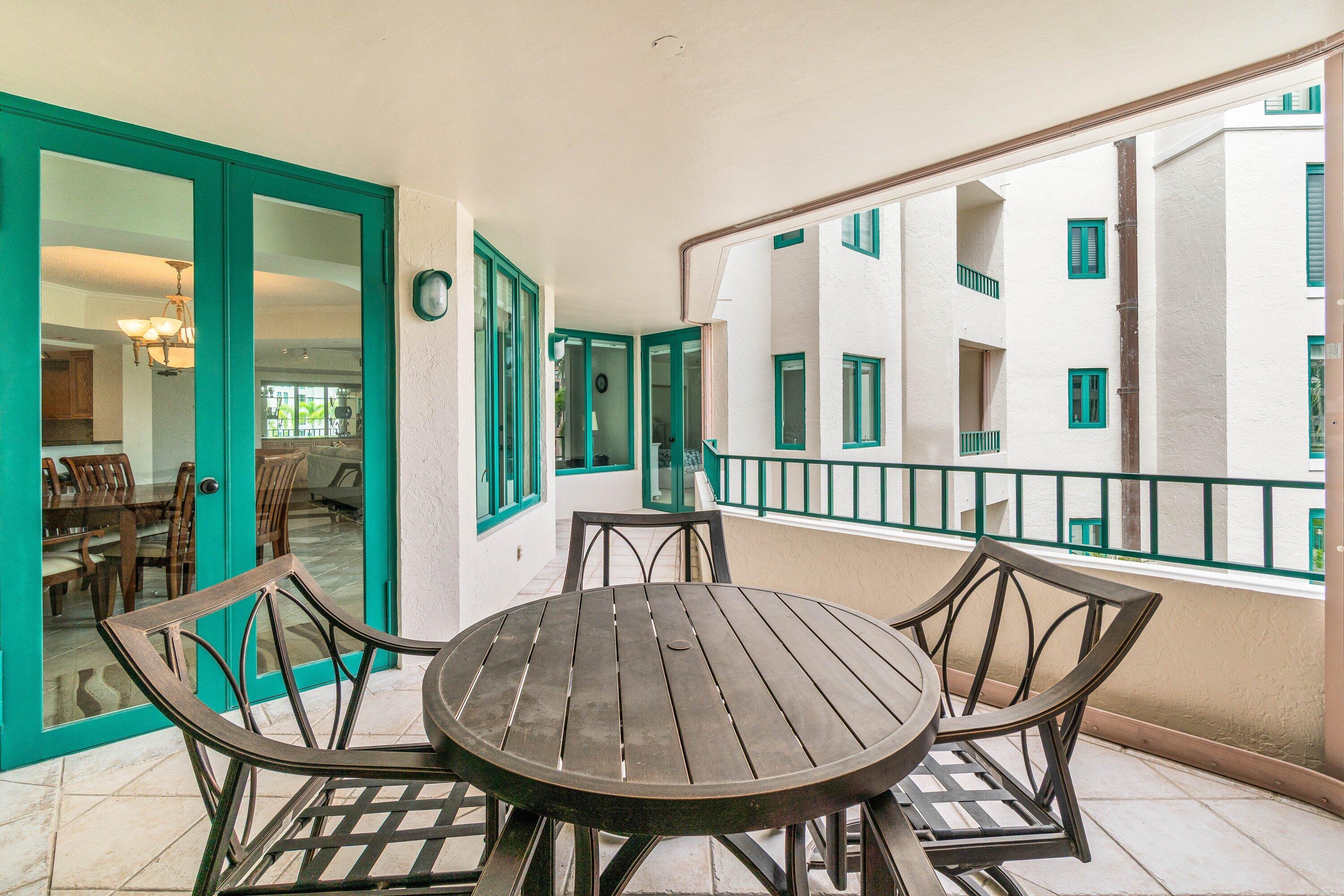 100 Southeast 5th Avenue, Unit 311 Boca Raton, FL 33432 - Photo 22 of 57 a view of a dining room with furniture window and wooden floor