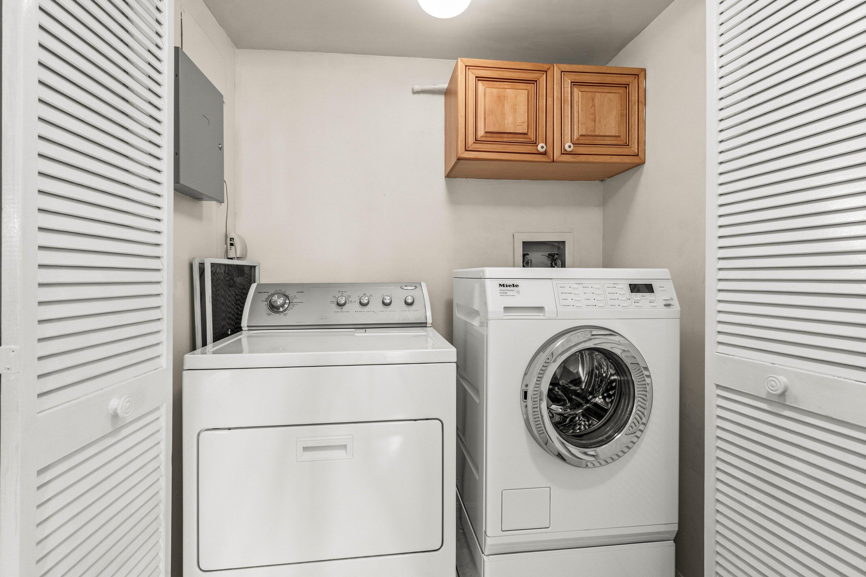 100 Southeast 5th Avenue, Unit 311 Boca Raton, FL 33432 - Photo 25 of 57 a utility room with dryer and washer