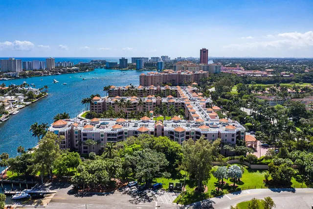 a view of a house with couches chairs and a fire pit