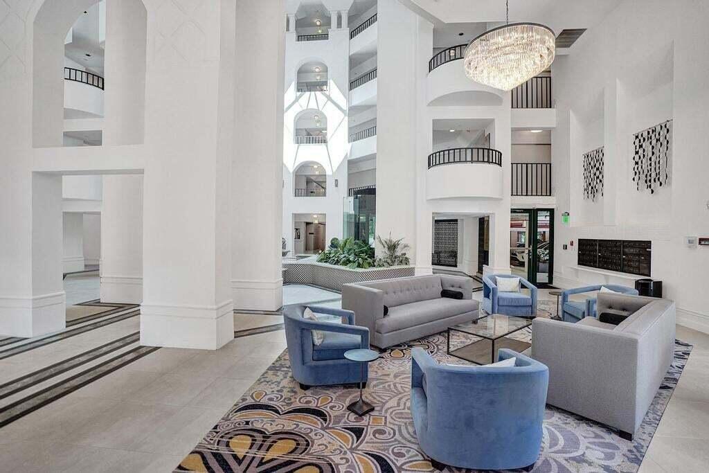 100 Southeast 5th Avenue, Unit 311 Boca Raton, FL 33432 - Photo 33 of 57 a living room with fireplace furniture and decor