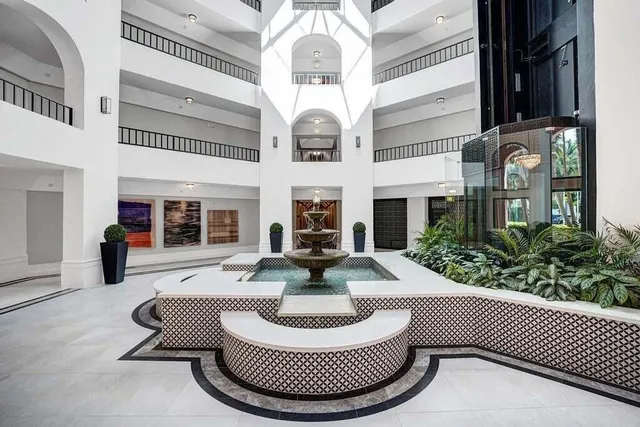 a view of residential houses with outdoor space and lake view