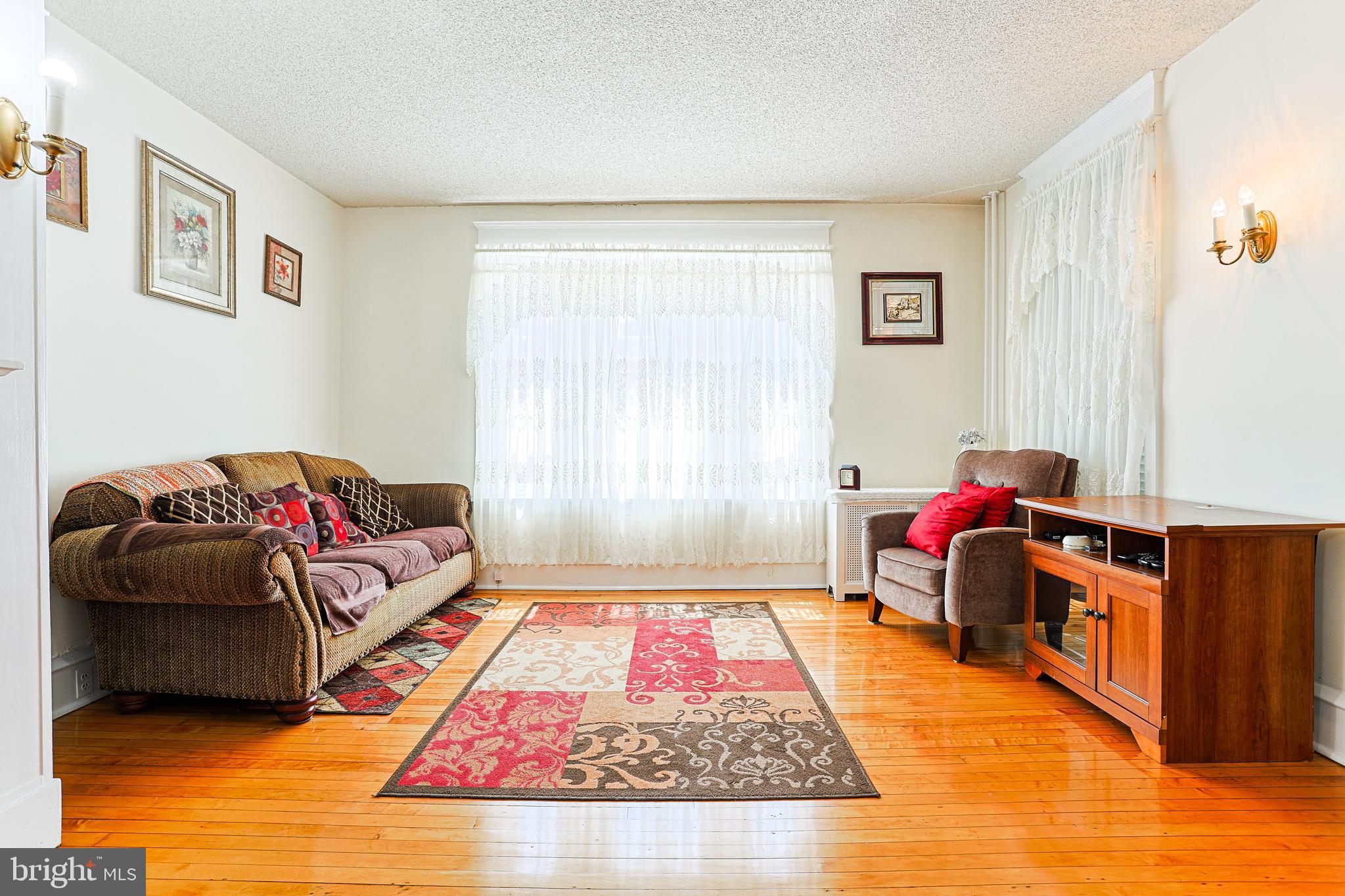 5236 Ridge Avenue Philadelphia, PA 19128 - Photo 16 of 45 a living room with furniture and a rug