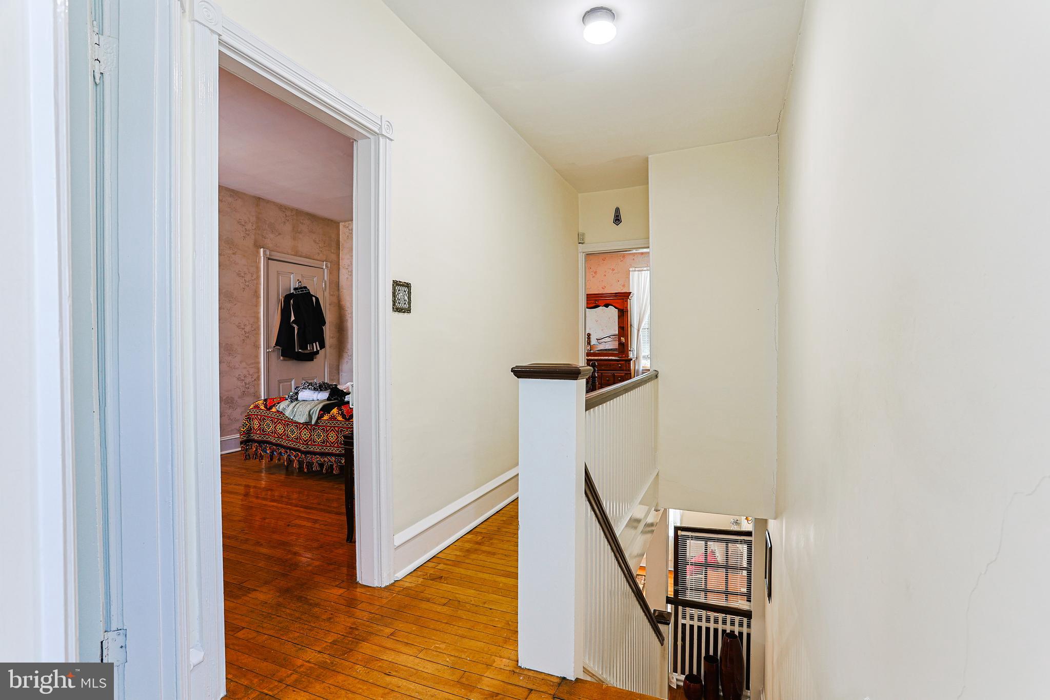 5236 Ridge Avenue Philadelphia, PA 19128 - Photo 22 of 45 a view of a hallway with wooden floor and stairs