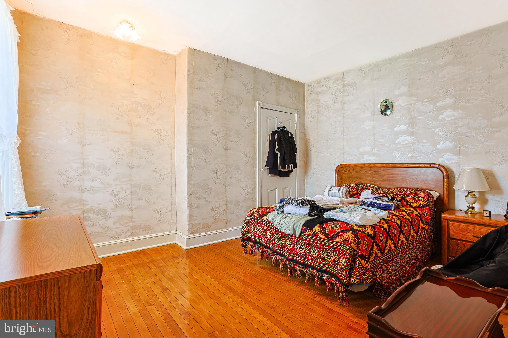 5236 Ridge Avenue Philadelphia, PA 19128 - Photo 28 of 45 a bedroom with a bed and window