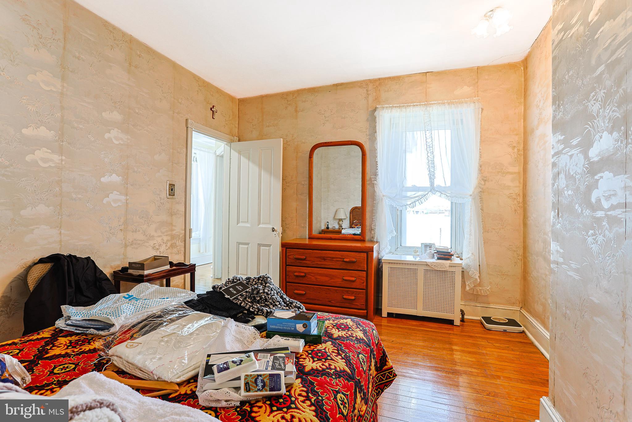 5236 Ridge Avenue Philadelphia, PA 19128 - Photo 29 of 45 a bedroom with bed and wooden floor