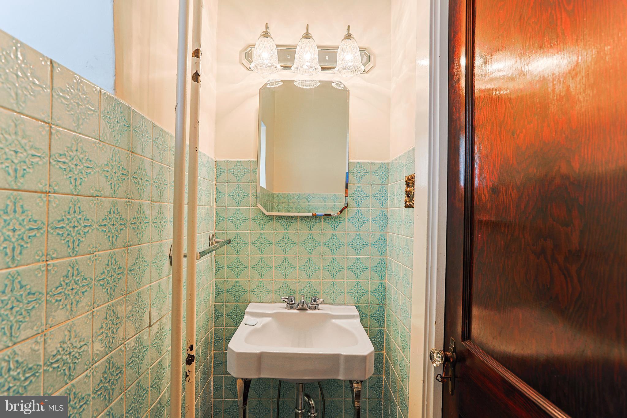 5236 Ridge Avenue Philadelphia, PA 19128 - Photo 39 of 45 a bathroom with a sink and mirror