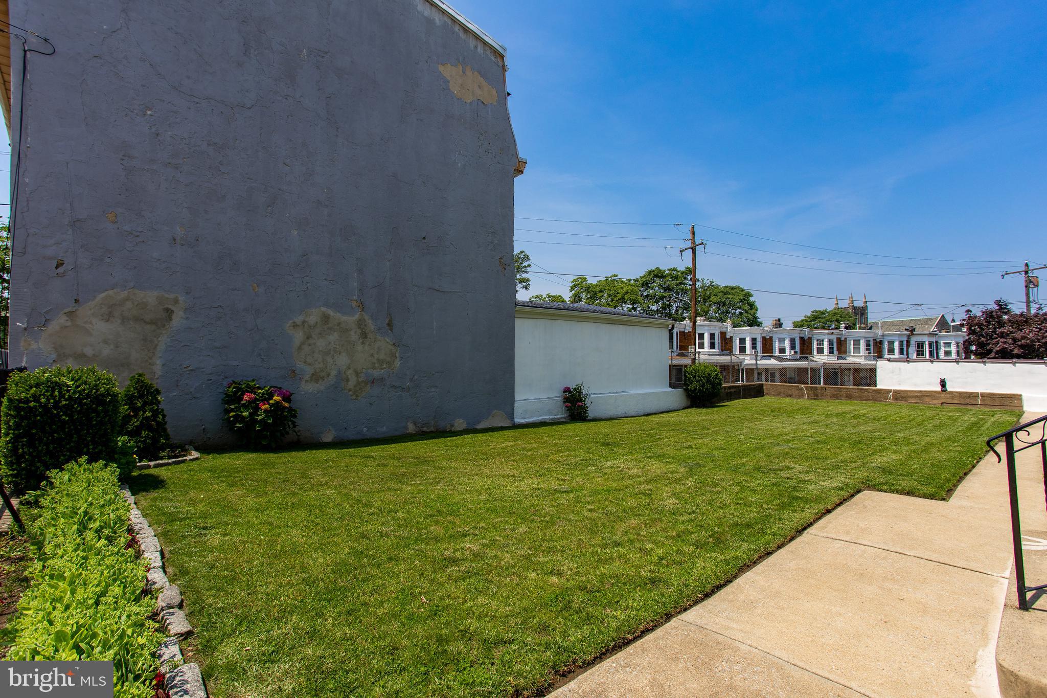5236 Ridge Avenue Philadelphia, PA 19128 - Photo 40 of 45 a view of a garden with a building in the background