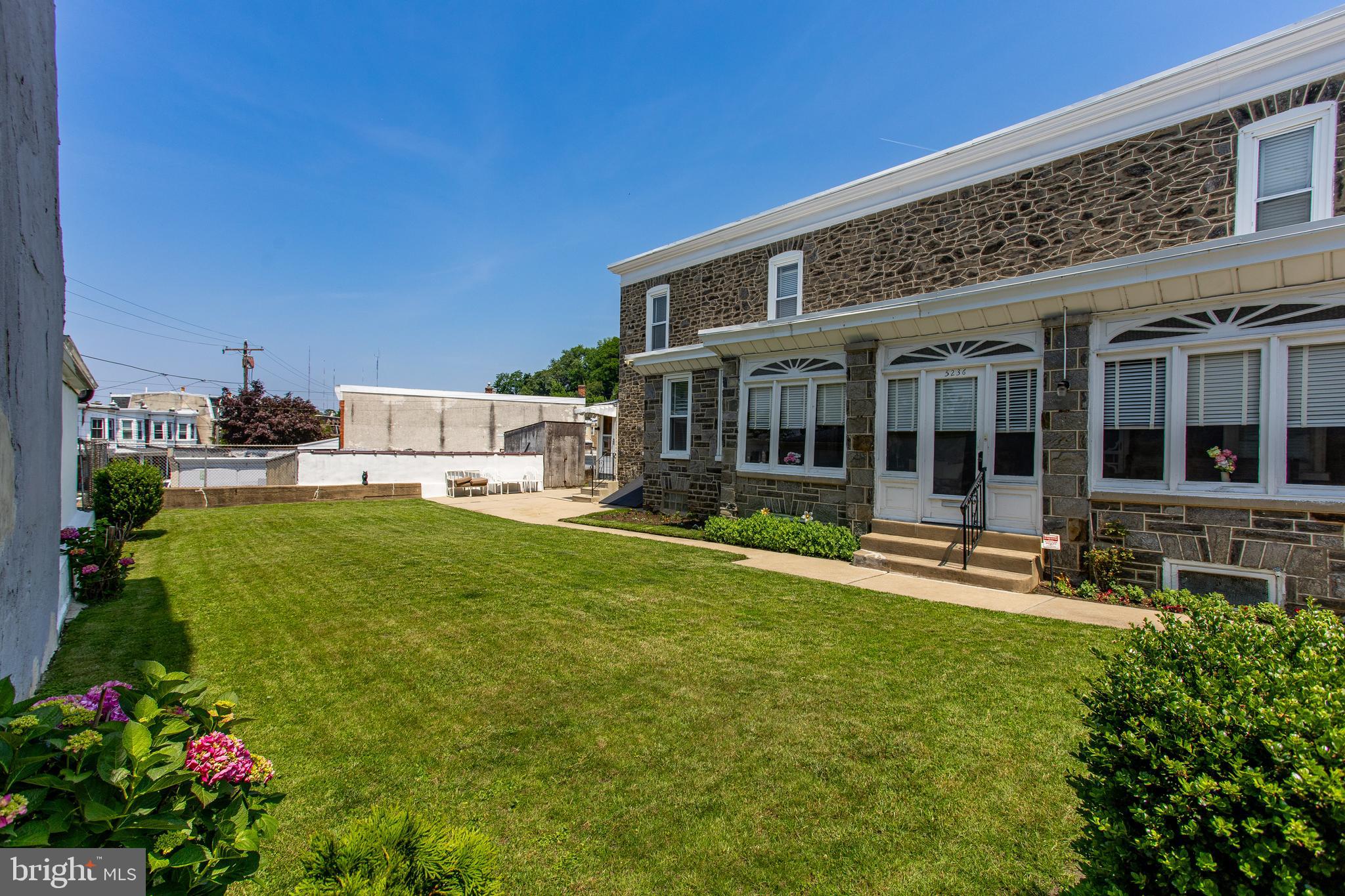 5236 Ridge Avenue Philadelphia, PA 19128 - Photo 45 of 45 front view of a house with a yard