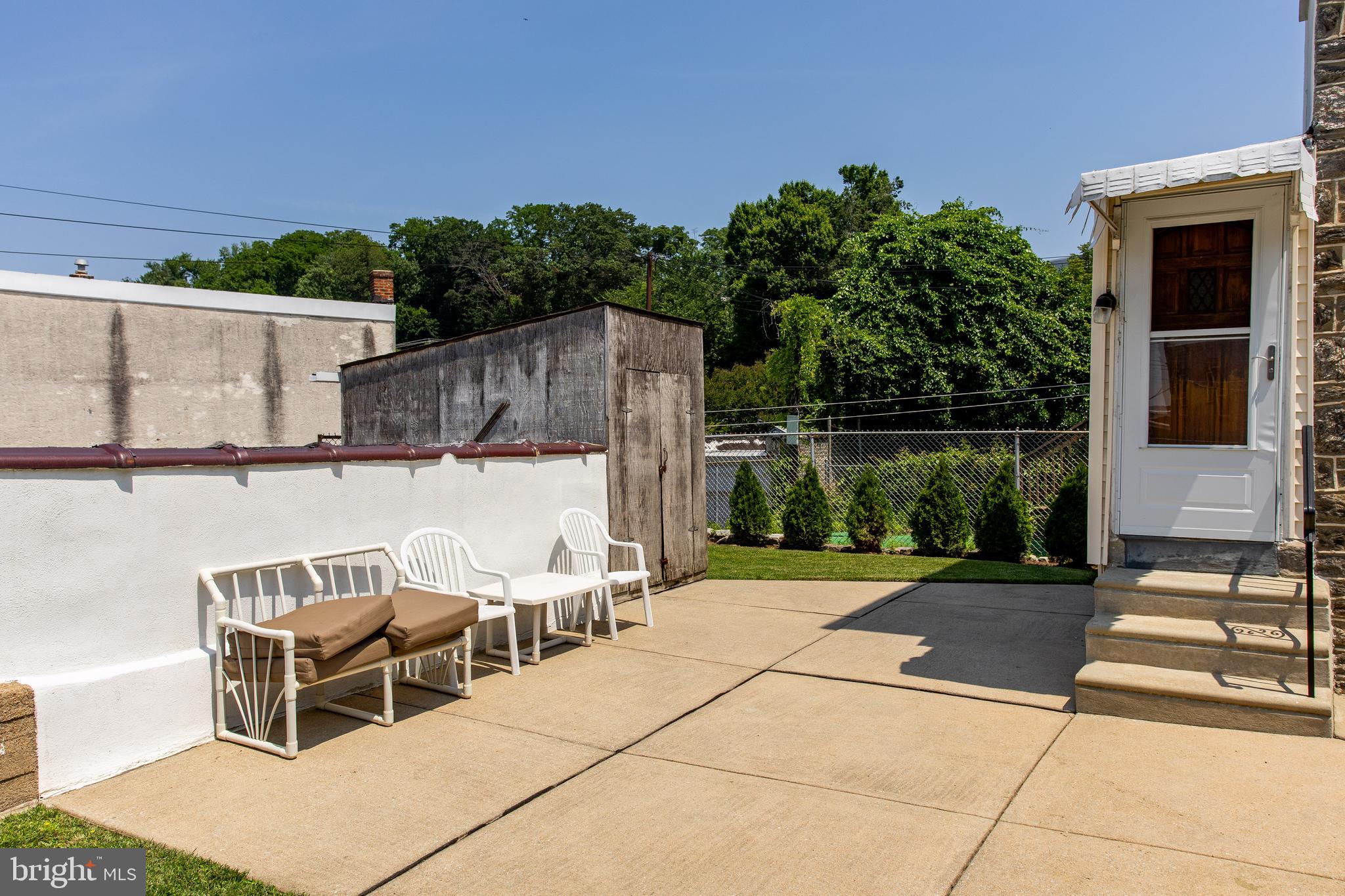 5236 Ridge Avenue Philadelphia, PA 19128 - Photo 7 of 45 a view of a patio with table and chairs with wooden floor and fence