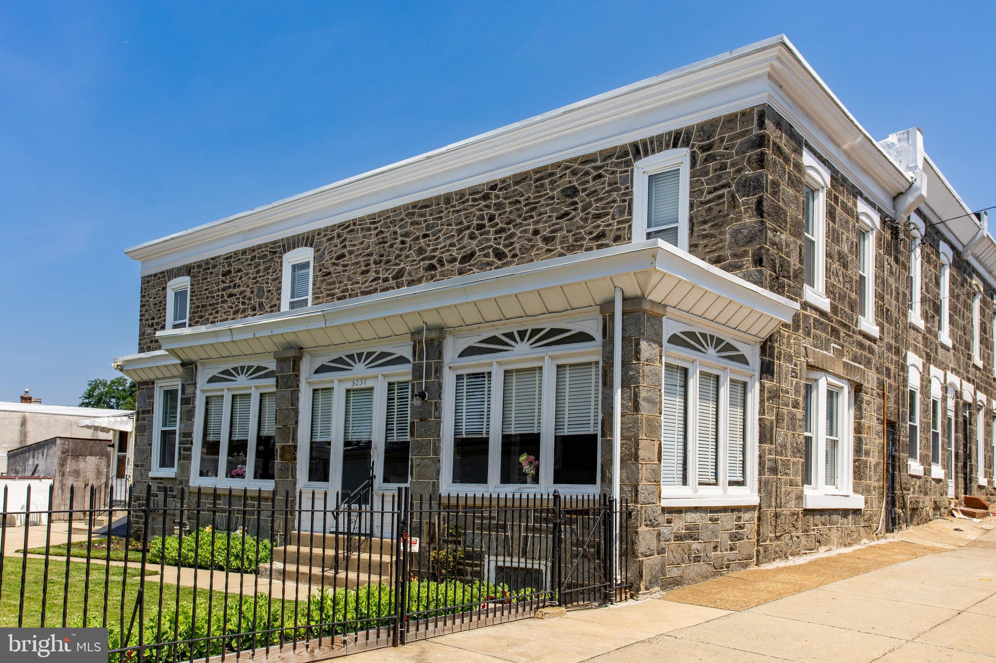 5236 Ridge Avenue Philadelphia, PA 19128 - Photo 10 of 45 a front view of a house with a porch