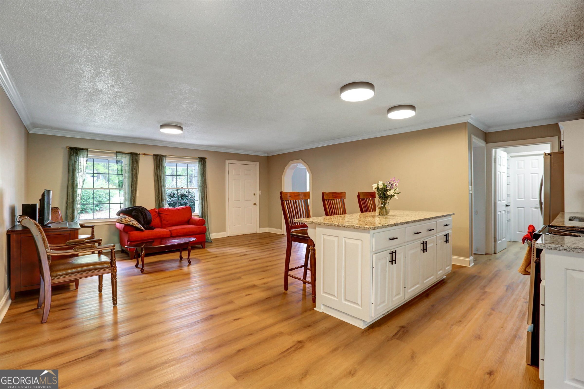 1095 Athens Road Winterville, GA 30683 - Photo 11 of 32 a living room with furniture and a large window