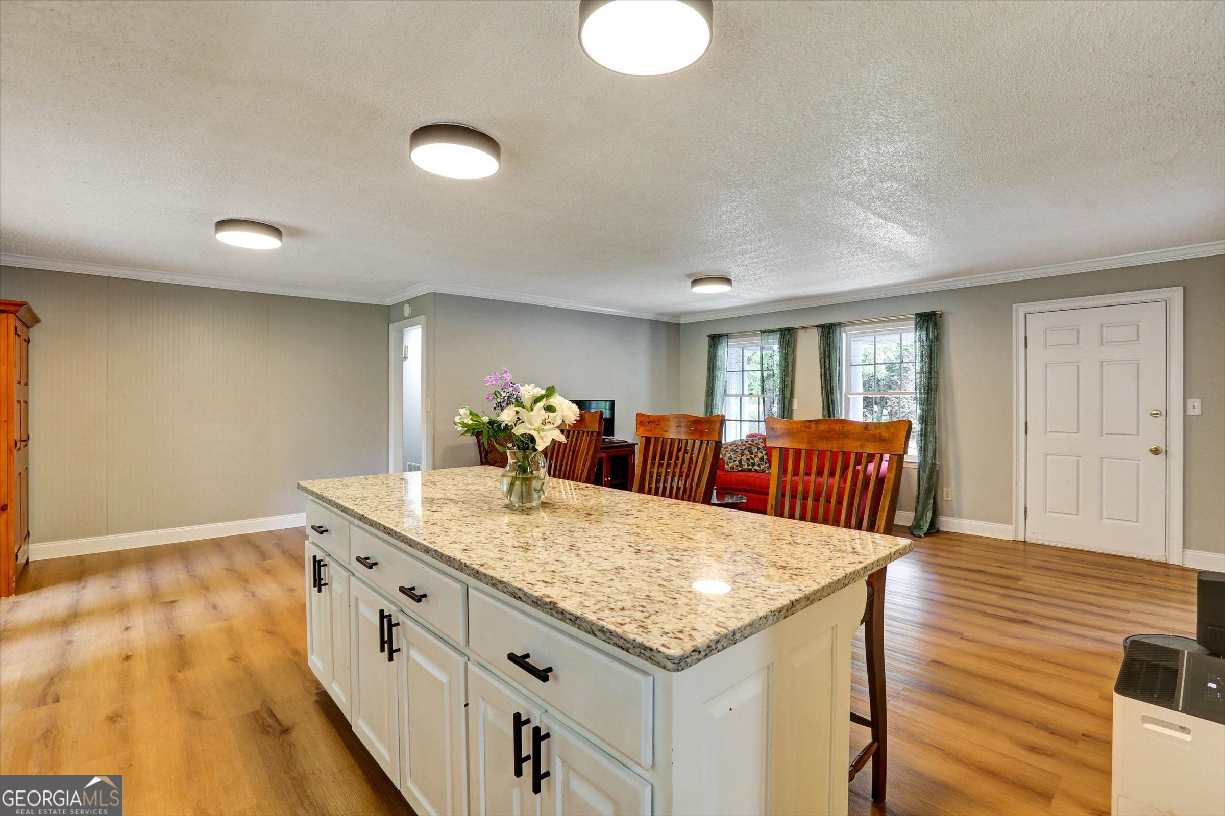 1095 Athens Road Winterville, GA 30683 - Photo 12 of 32 a living room with furniture and a table