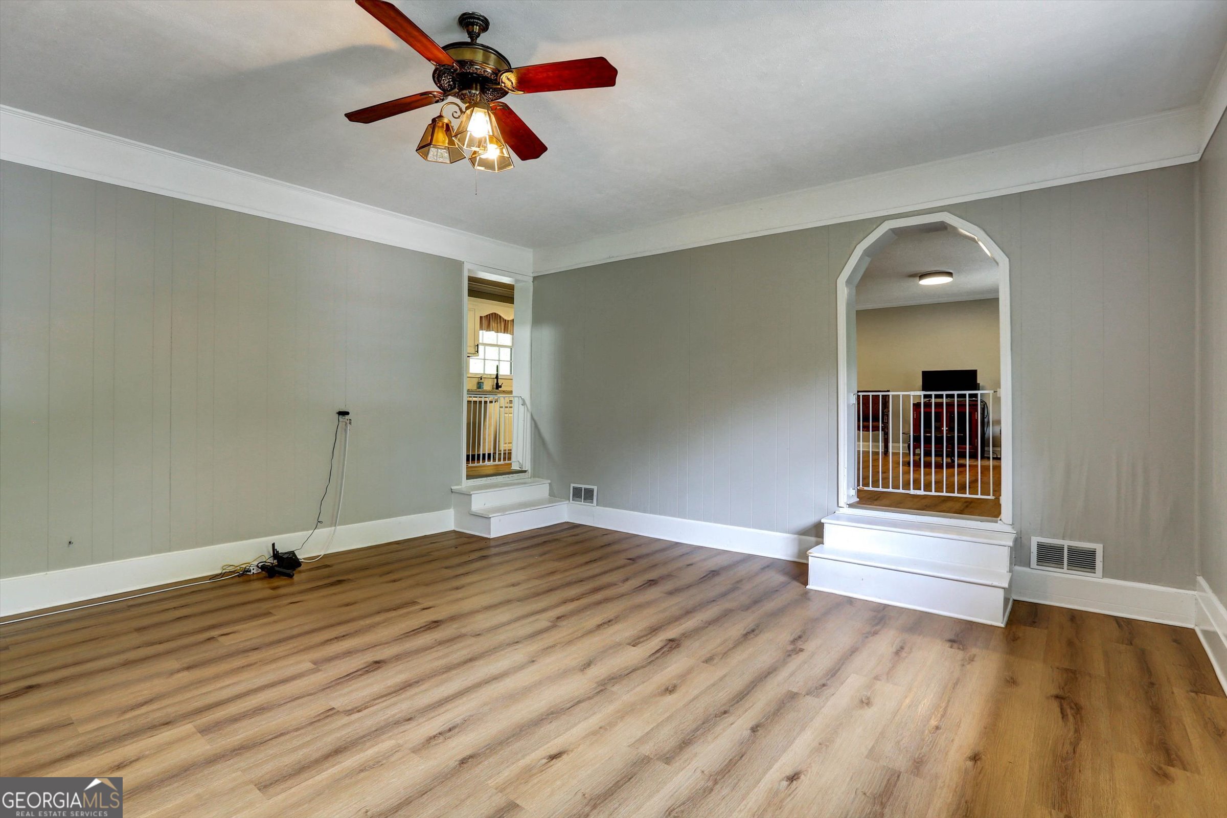 1095 Athens Road Winterville, GA 30683 - Photo 14 of 32 a view of an empty room with window and wooden floor