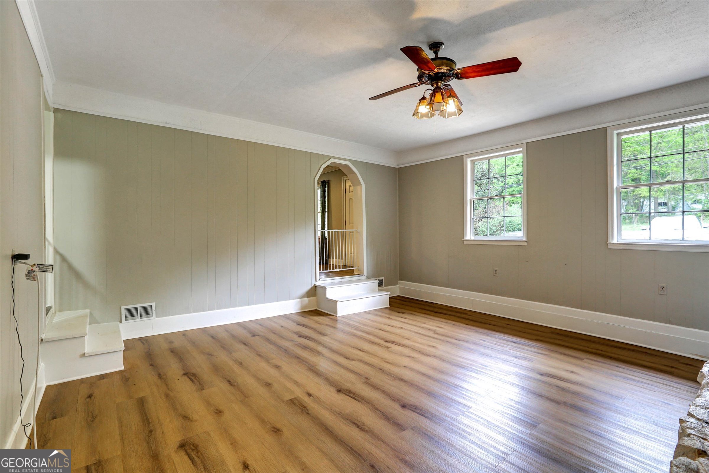 1095 Athens Road Winterville, GA 30683 - Photo 17 of 32 wooden floor in an empty room with a window