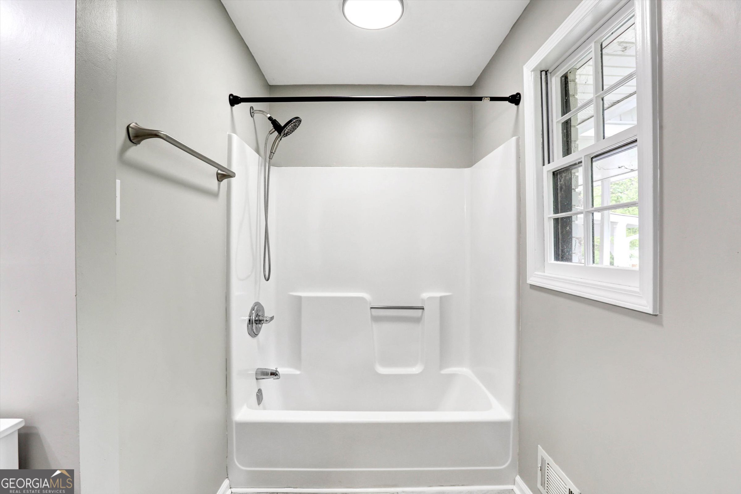 1095 Athens Road Winterville, GA 30683 - Photo 23 of 32 a bathroom with a shower and a bath tub