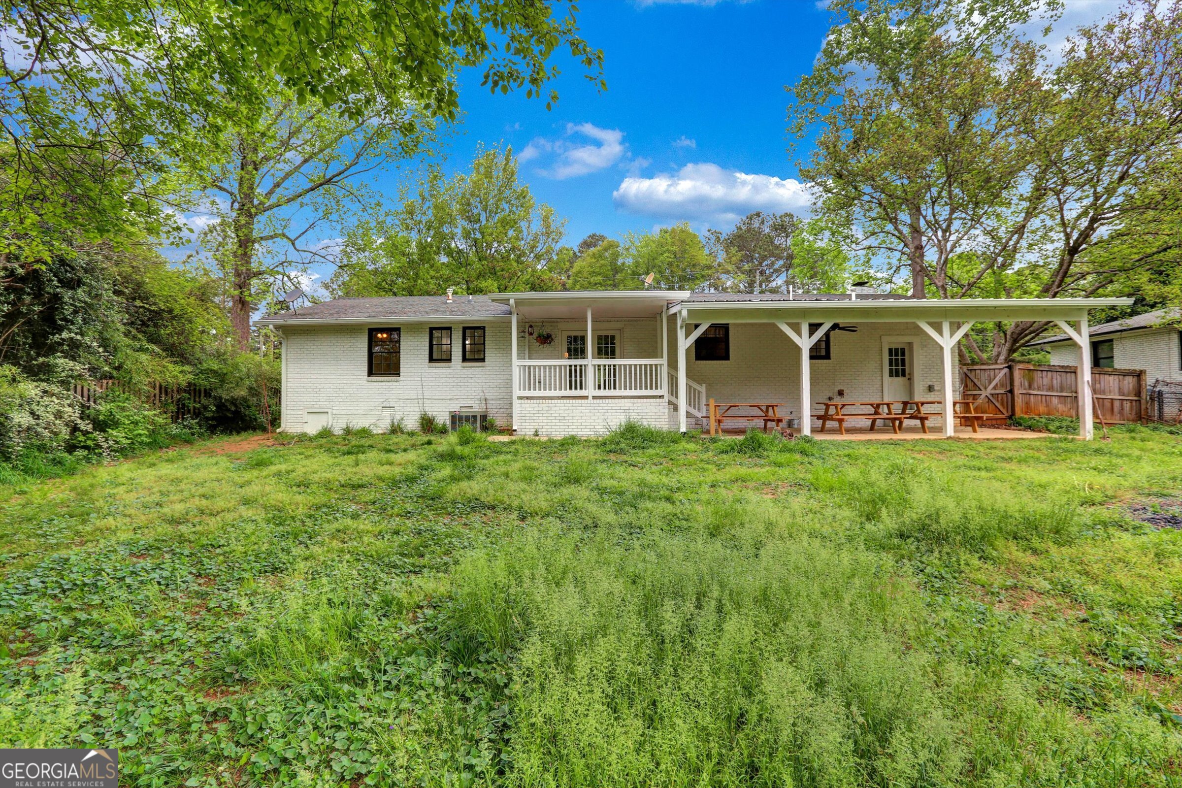 1095 Athens Road Winterville, GA 30683 - Photo 28 of 32 a view of a house with backyard and garden