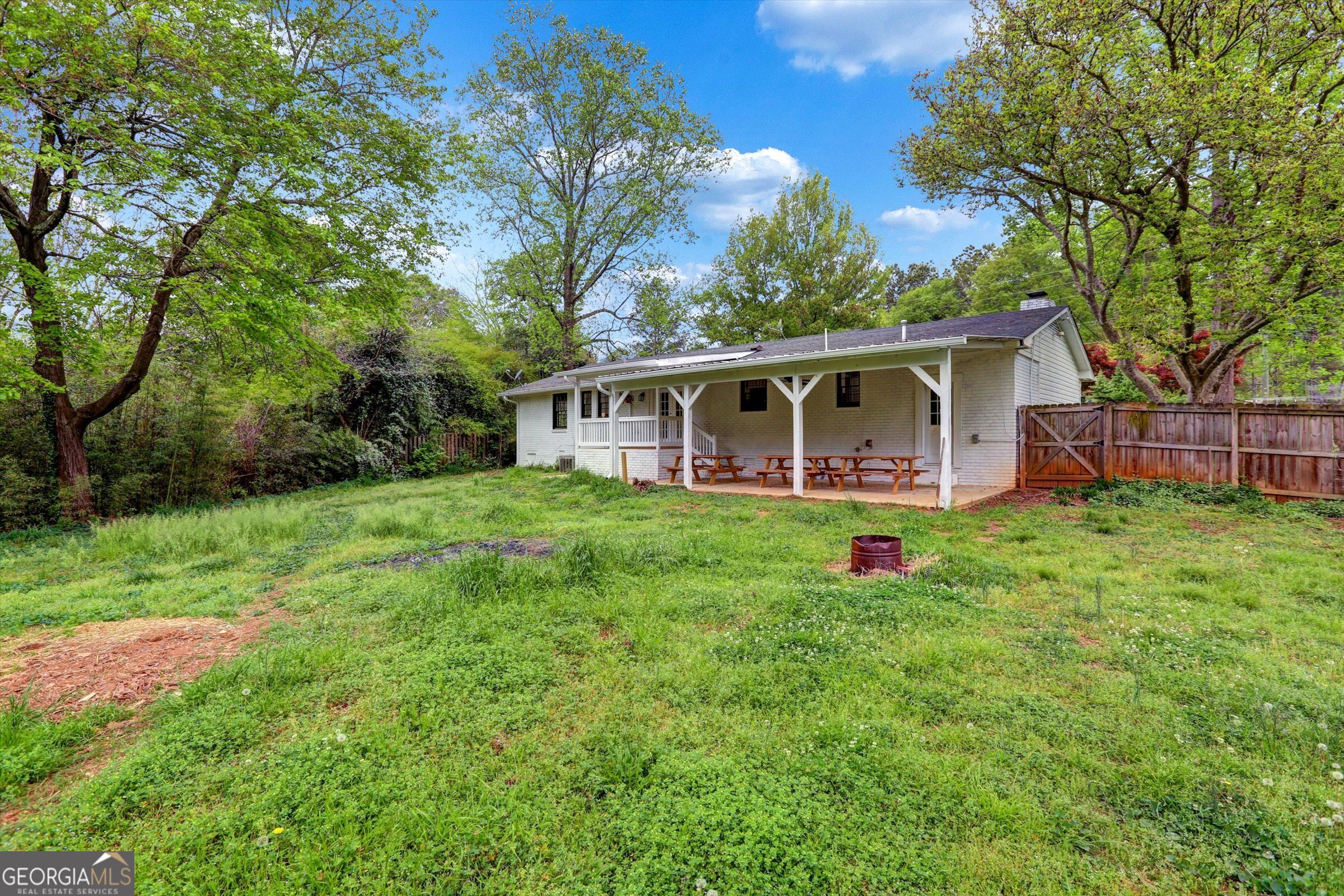 1095 Athens Road Winterville, GA 30683 - Photo 30 of 32 a view of a house with backyard and sitting area
