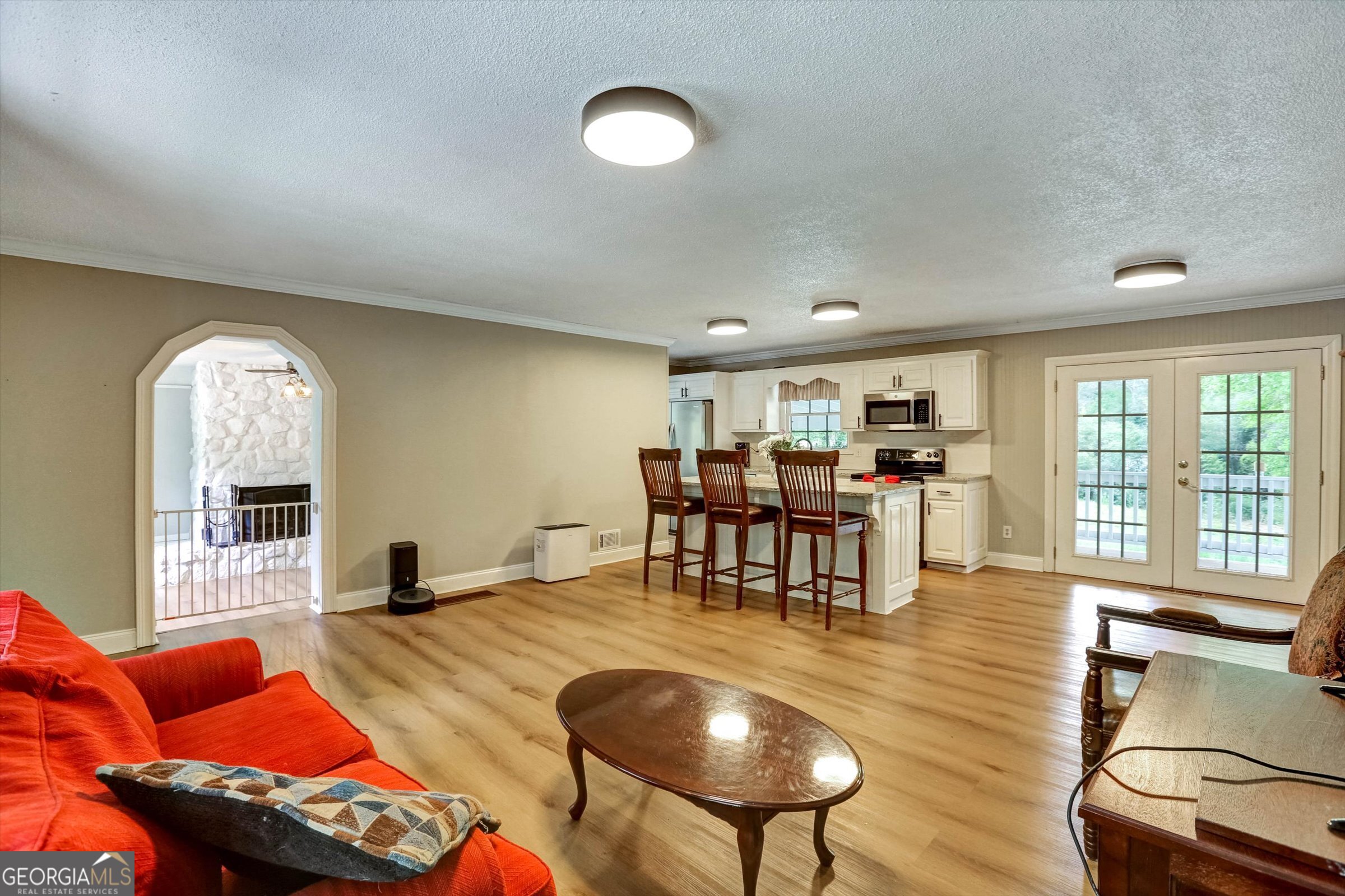 1095 Athens Road Winterville, GA 30683 - Photo 10 of 32 a living room with furniture and a large window